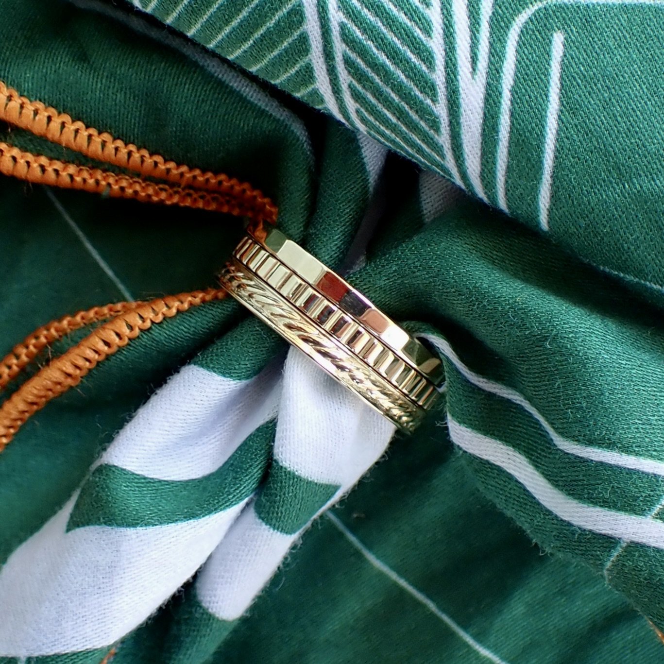 14k Yellow Gold Faceted Band - $990 14k Yellow Gold Braided Pattern Band - $1230 14k Yellow Gold Ridged Band - $990