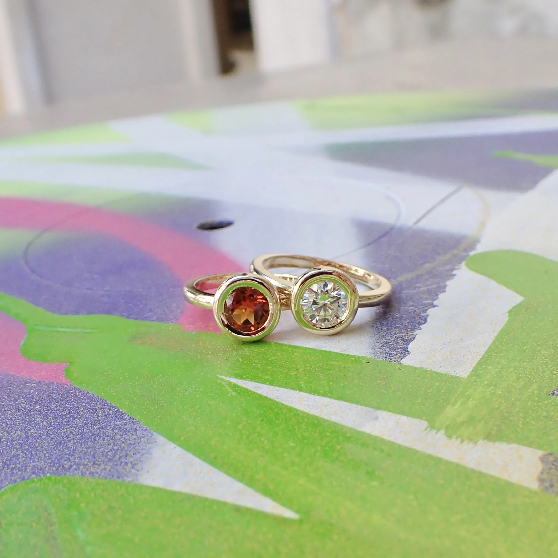 14k Yellow Gold Ring Contemporary Bezel Set Ring with a 6mm Brilliant Citrine - $1920   14k Yellow Gold Ring Contemporary Bezel Set Ring with a 0.80 carat Brilliant Cut Lab Grown Diamond - $2245 