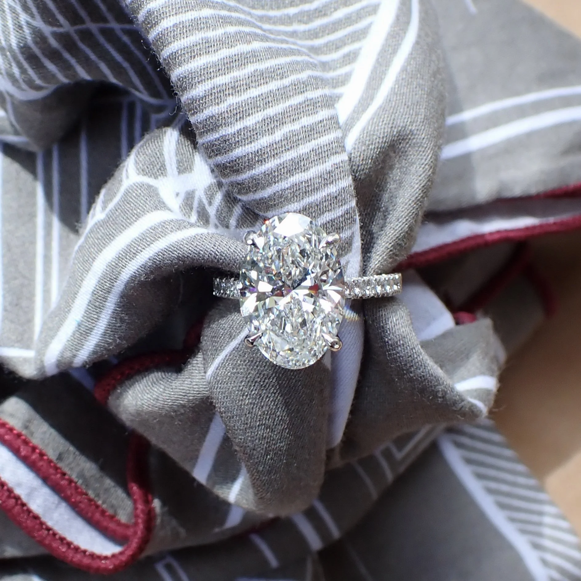 Platinum Engagement Ring with a 5.00 carat Oval Brilliant Cut Lab Grown Diamond and 0.37 carats of Lab Grown Diamond - $5115 (5.00 carat Oval Brilliant Cut Lab Grown Diamond with Clarity Grade VVS2 and Color Grade E With IGI Report: LG6966544090)