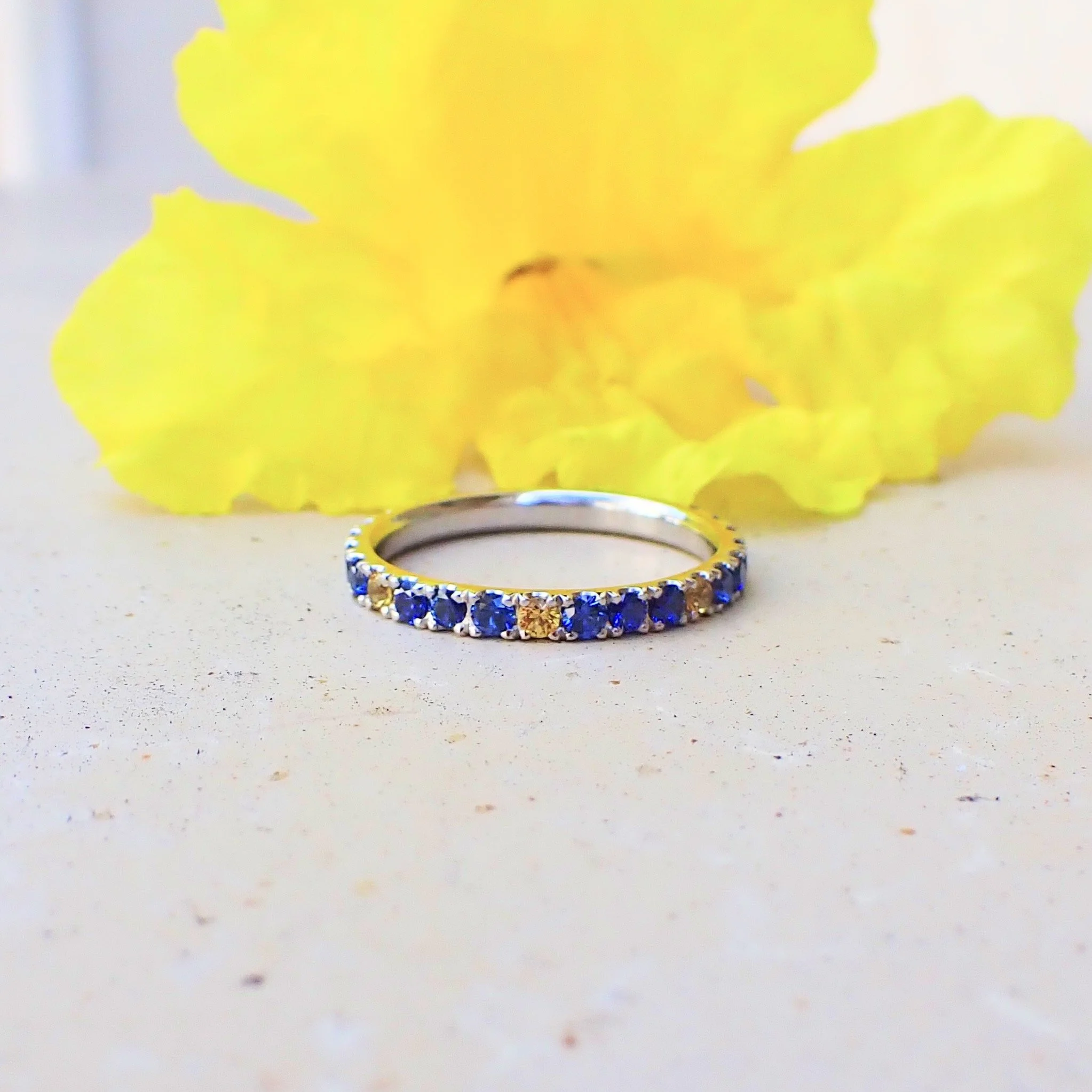 Platinum Eternity Band with 0.85 carats of Blue Sapphire and 0.24 carats of Yellow Sapphire - $3565