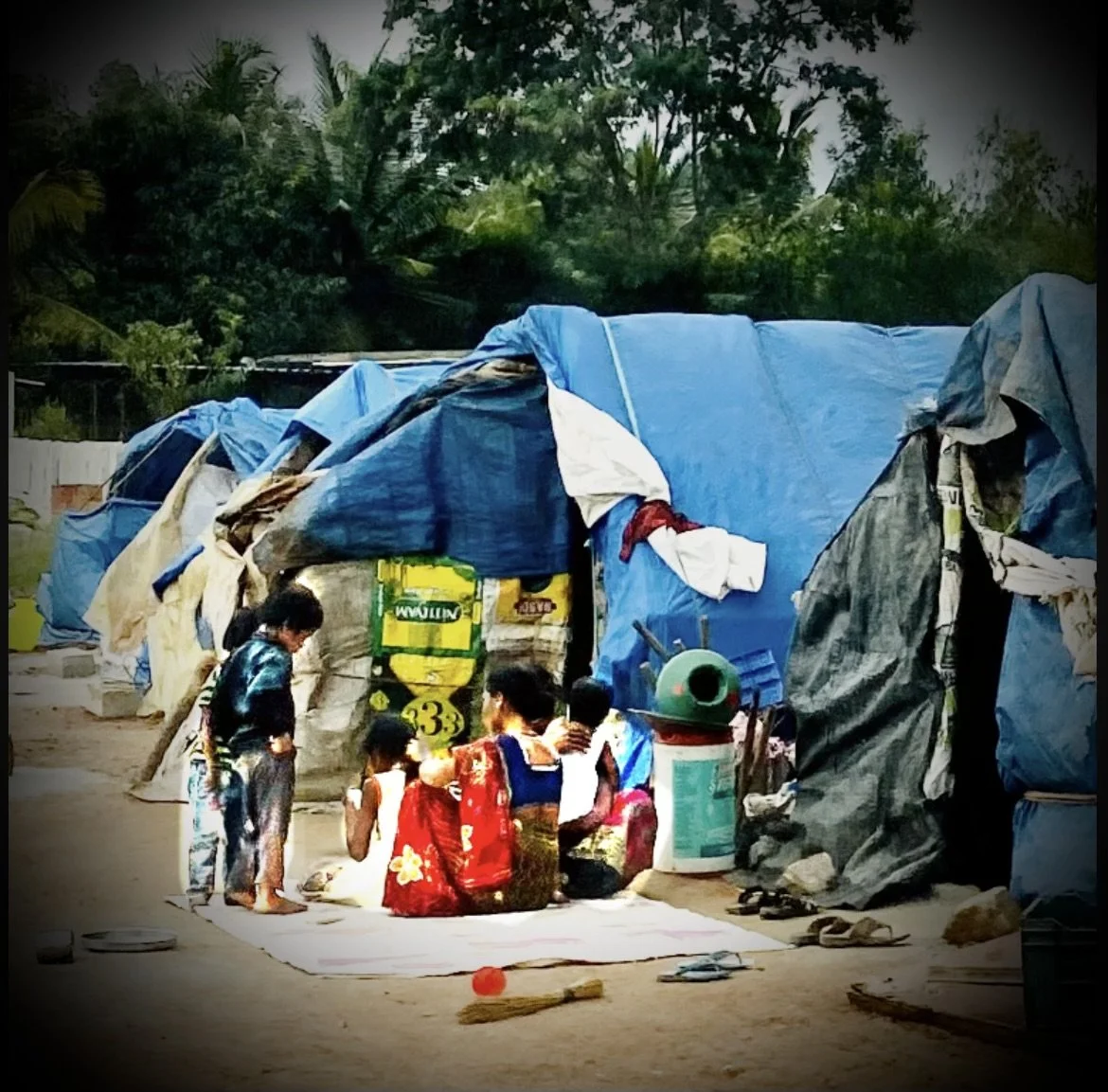 Family In A Blue Tarp House