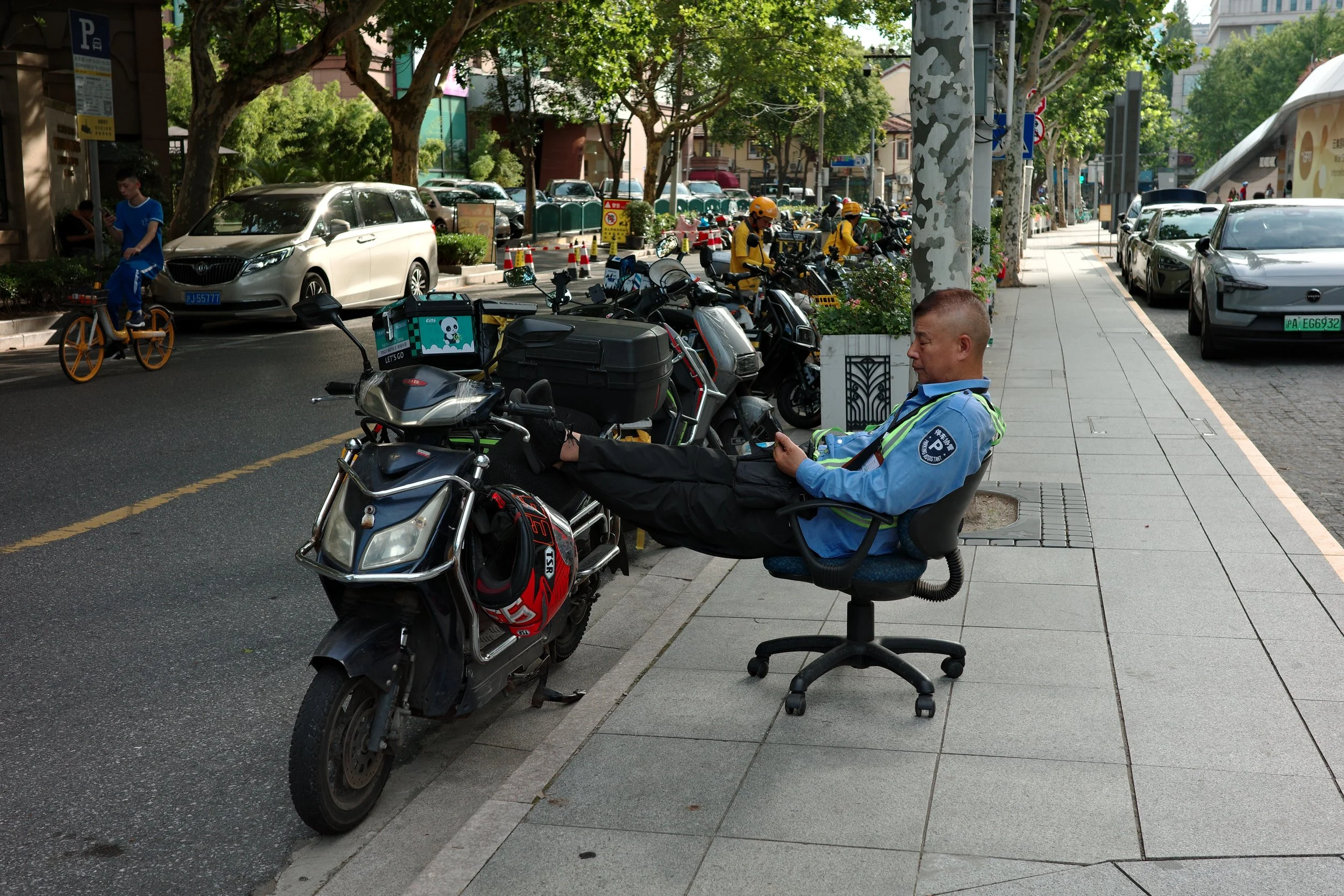 Man in Office Chair, Shanghai, 2025