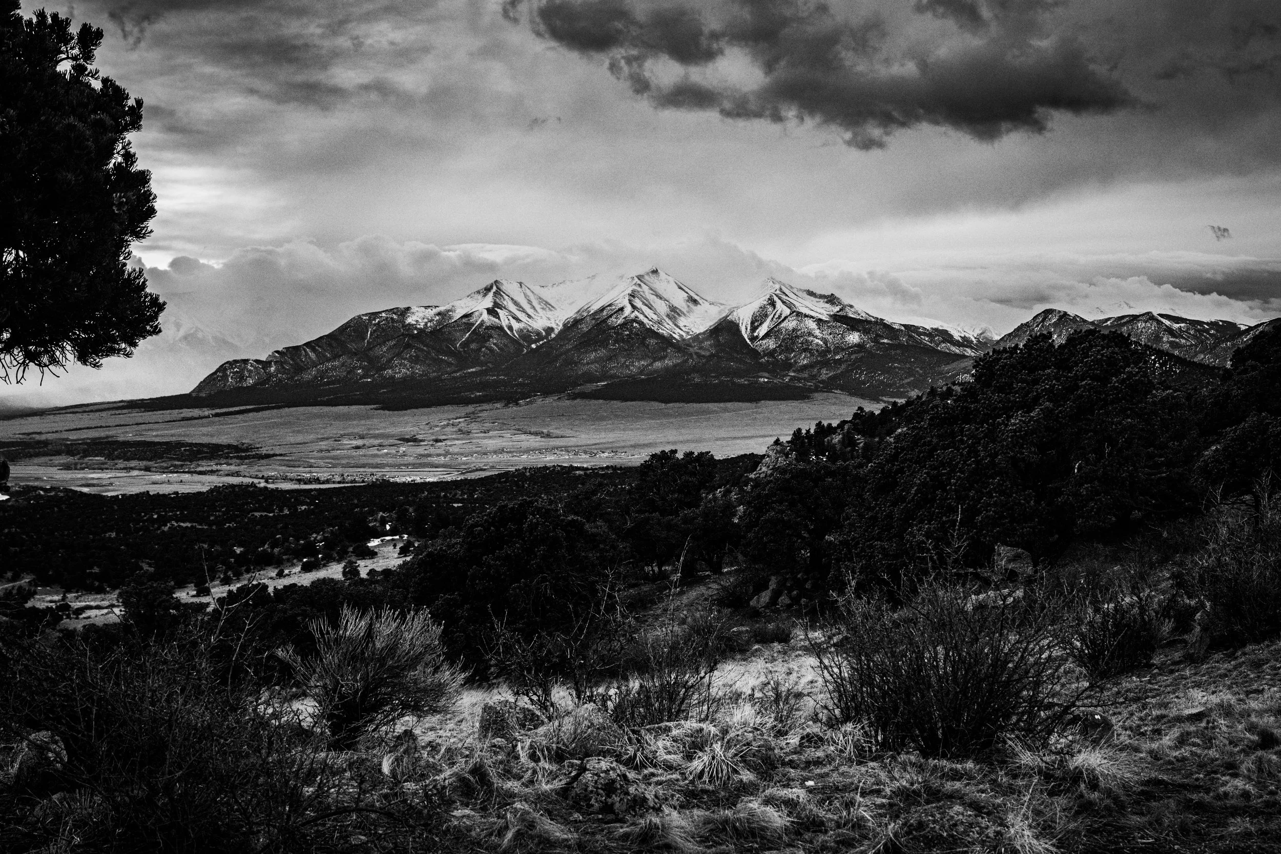 Black and white image of the collegiate peaks near Buena Vista, Colorado on a stormy summer spring evening. 