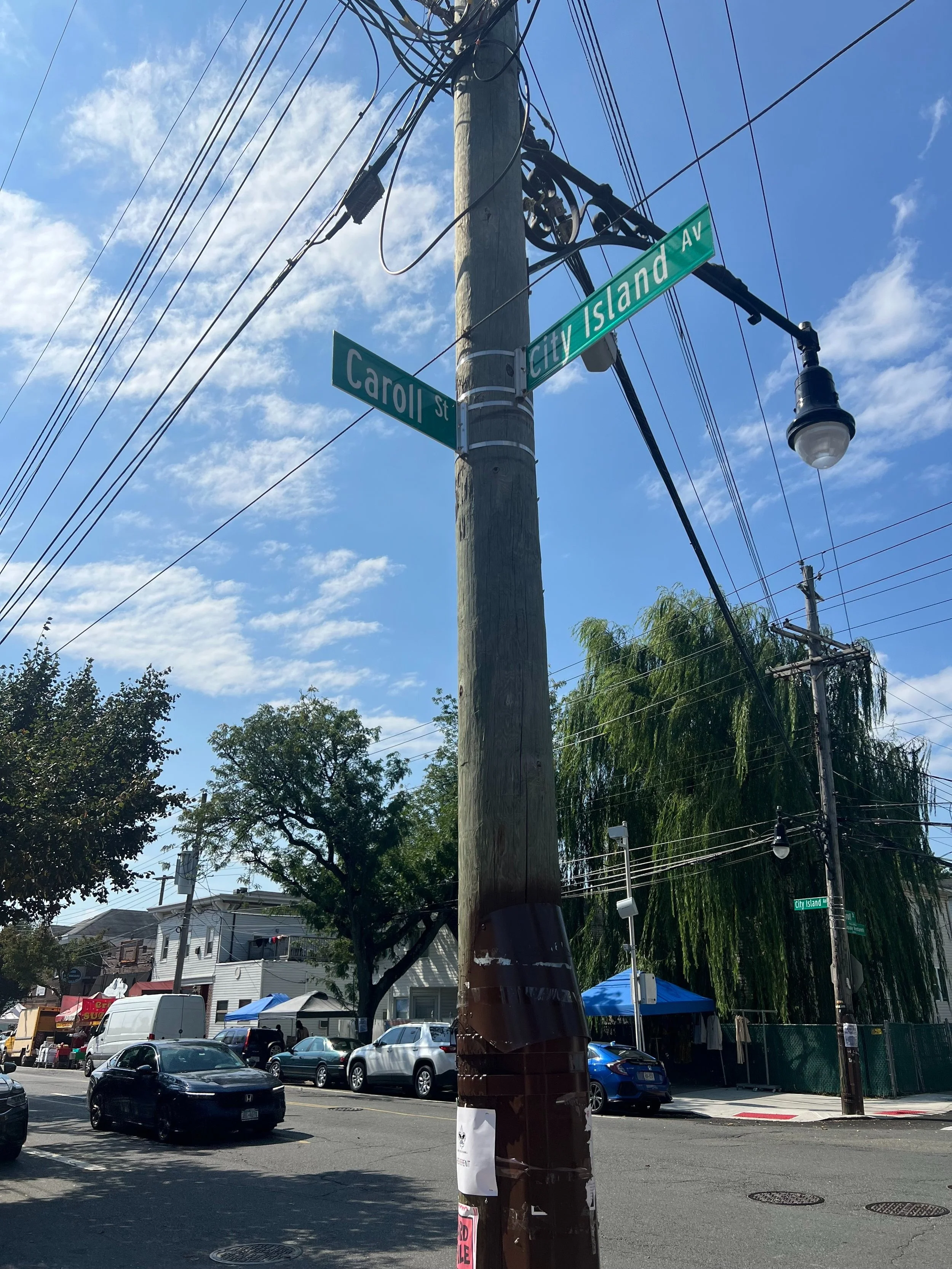 The street sign with the signs for Caroll Street and City Island Avenue visible on City Island in the Bronx, New York City