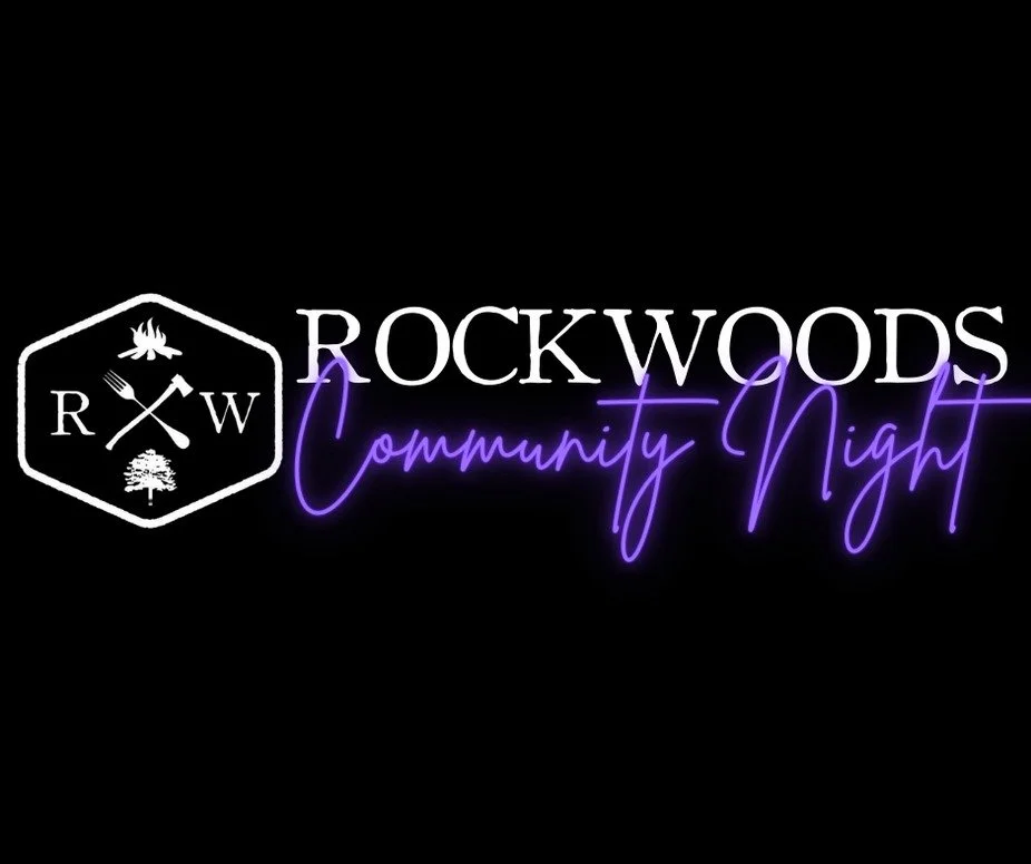 ROC Builders sponsors Rockwoods Community Night featuring a black background, white and purple neon-style text, and a white hexagon emblem with symbols including a campfire, fork and knife, and a tree.