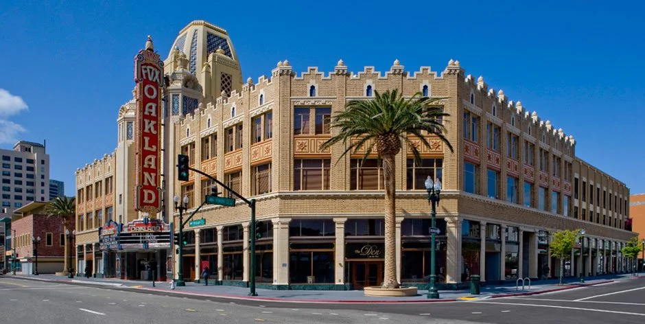 Exterior street view of the historic Fox Theater in Oakland, featuring its iconic vertical sign, ornate architecture, and structural engineering by PARADIGM.