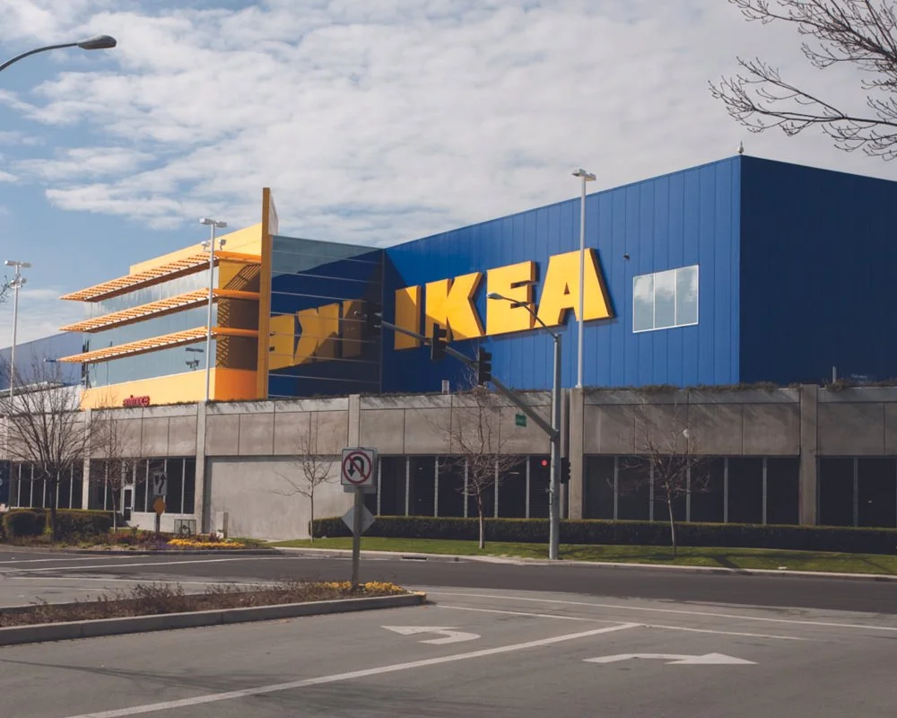 Exterior street view of the IKEA retail store building featuring its iconic blue and yellow architectural branding and structural design by PARADIGM.