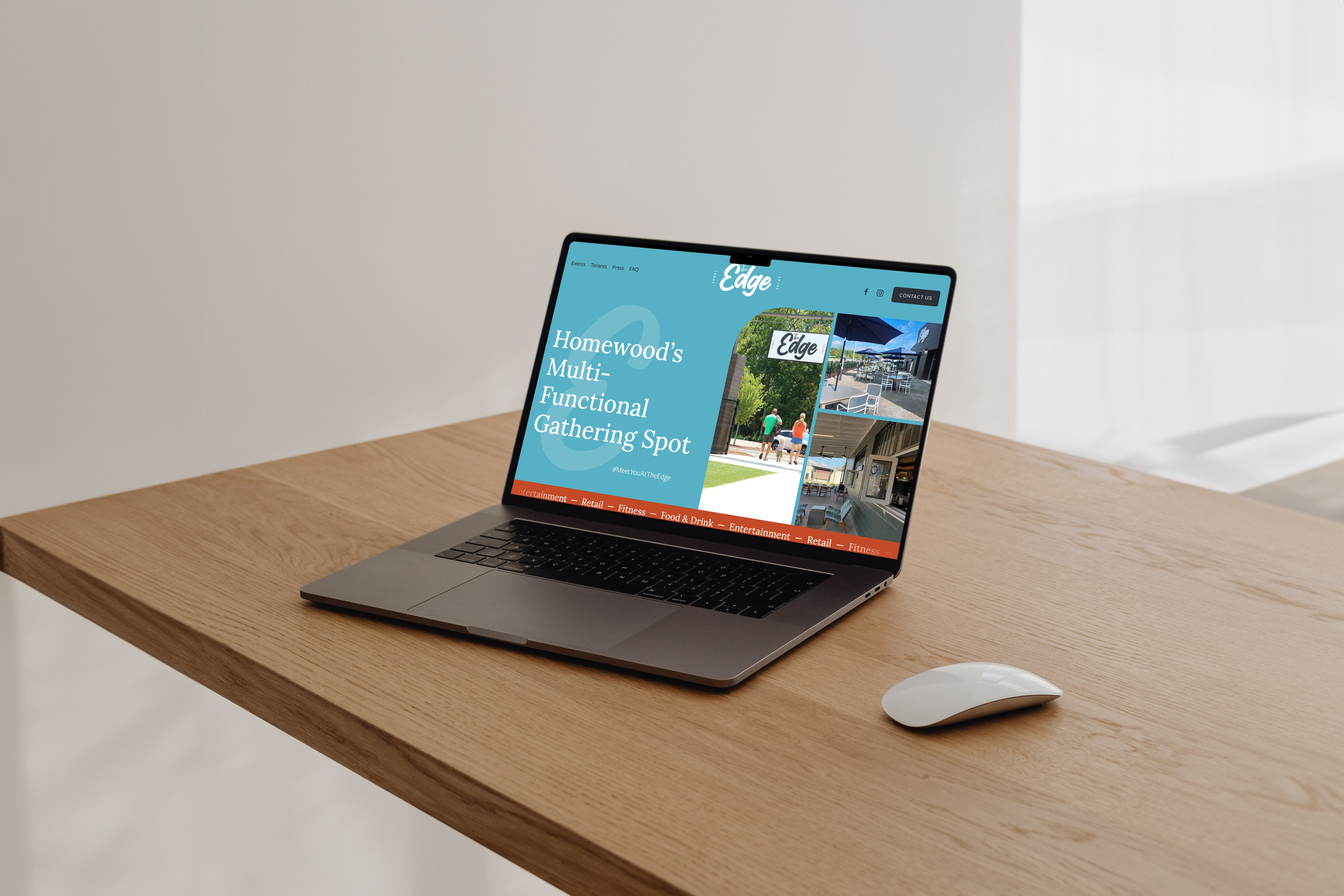 A laptop displaying a website about a multi-functional gathering spot called 'The Edge' on a wooden desk with a wireless mouse nearby. The website features outdoor and indoor spaces for events and social activities.