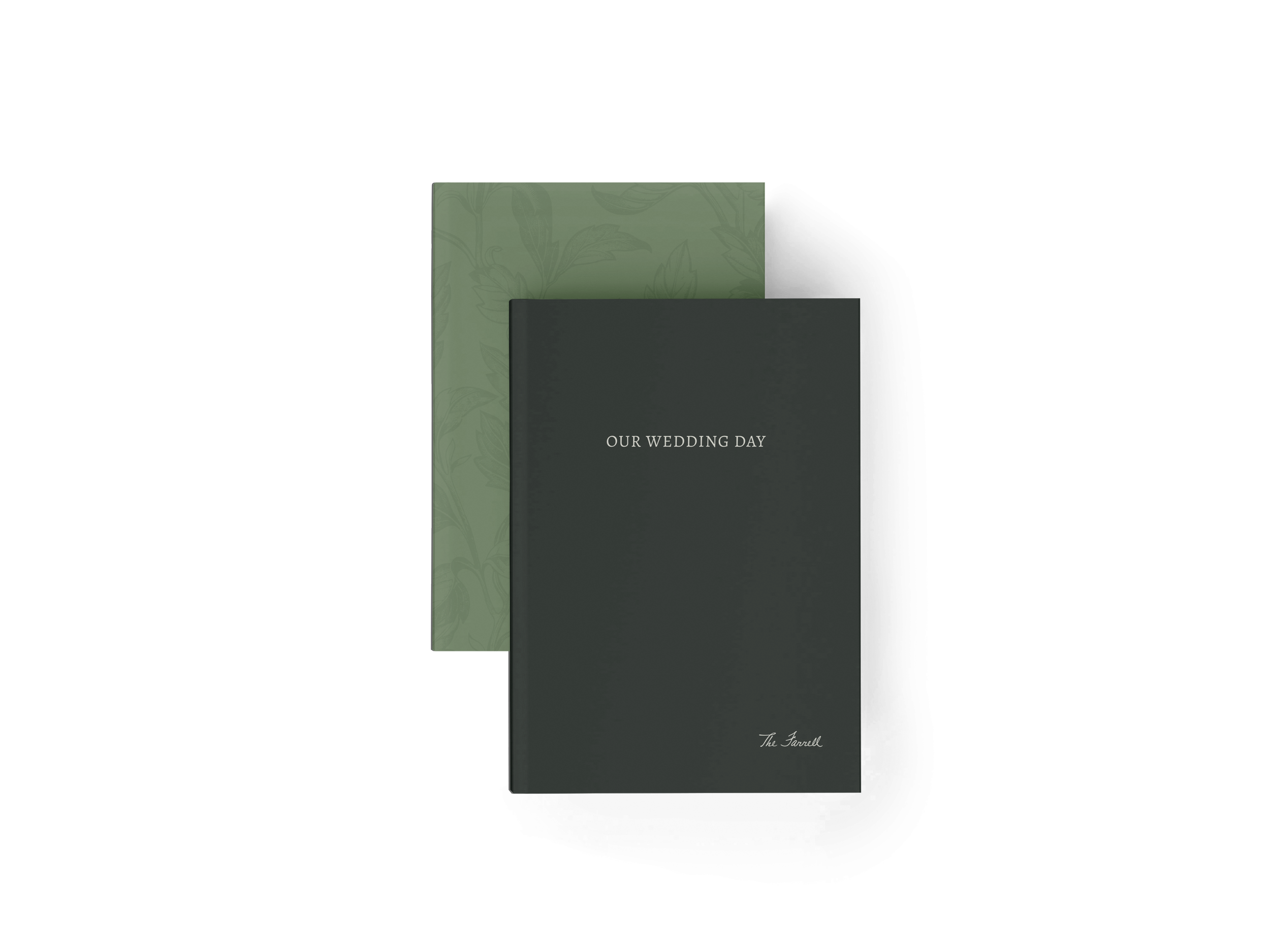 Three wedding programs or invitations, one dark gray with white text reading "Our Wedding Day," one green with a subtle floral pattern, and one smaller dark gray with a signature at the bottom right.