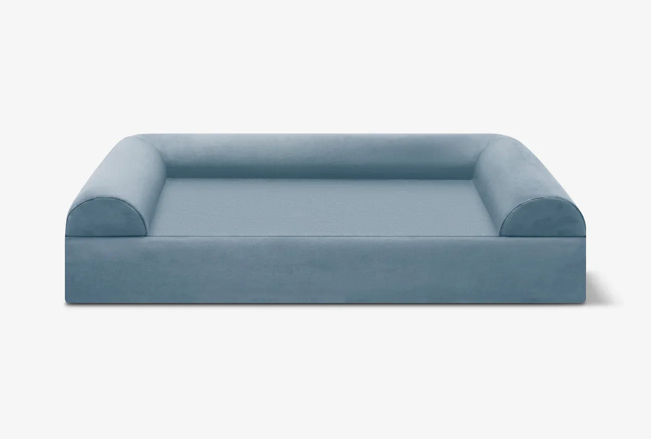 Light blue sofa with rounded armrests on a white background.