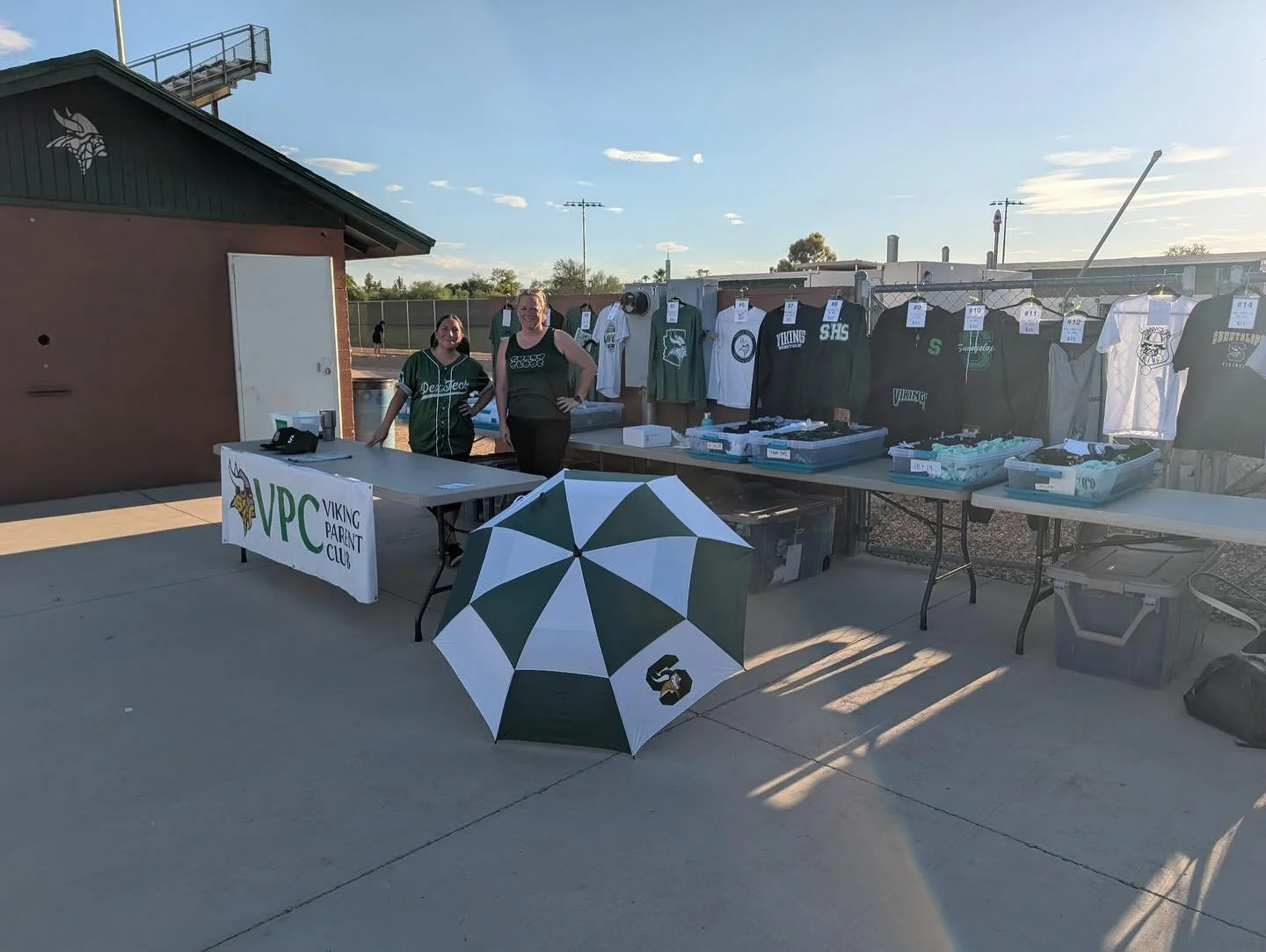 Set up and ready to help you find your favorite spirit wear!!! Come see us at JV Football 🏈 💚🤍