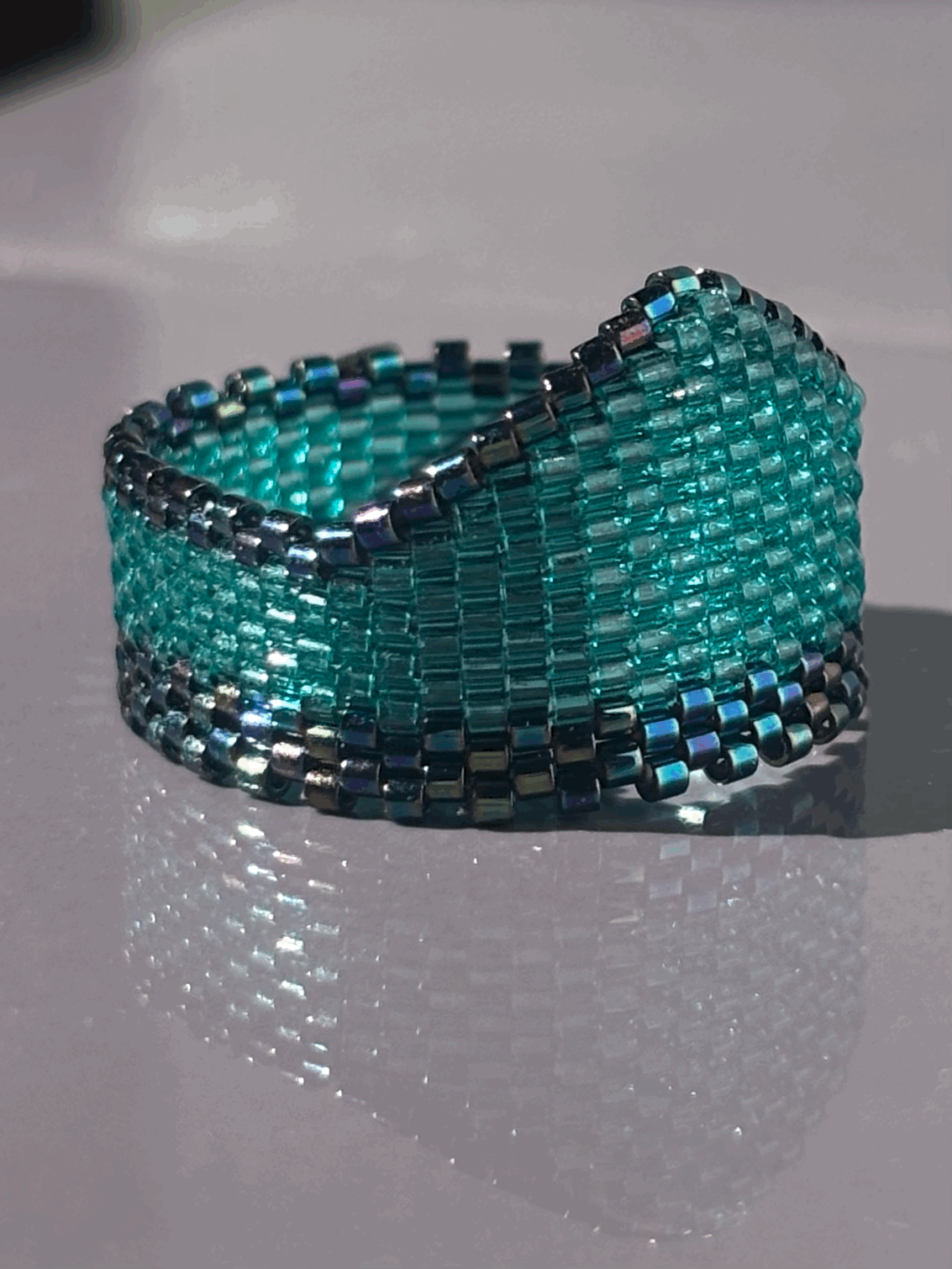 Right-side view of the Aqua Iris Widow’s Peak ring