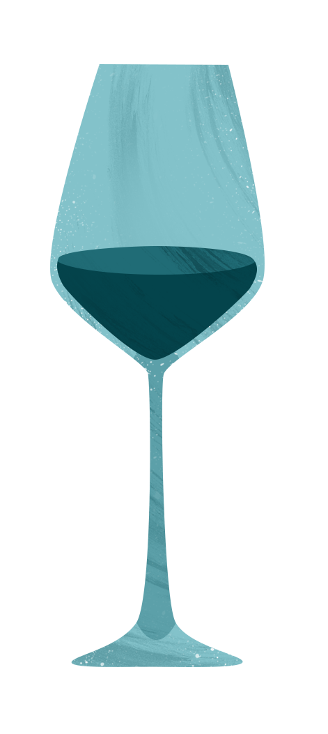 Ein Glas Weißwein auf einem Tisch, mit einem weichen, unscharfen Hintergrund.