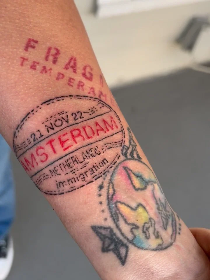 This was a passport stamp style tattoo that I really enjoyed doing for a gal who wants to fill up her arm with all her travels ✈️🌎🧳 lil globe and fragile label not by me but very cool! I&rsquo;d love to see this sleeve down the road with all the ta