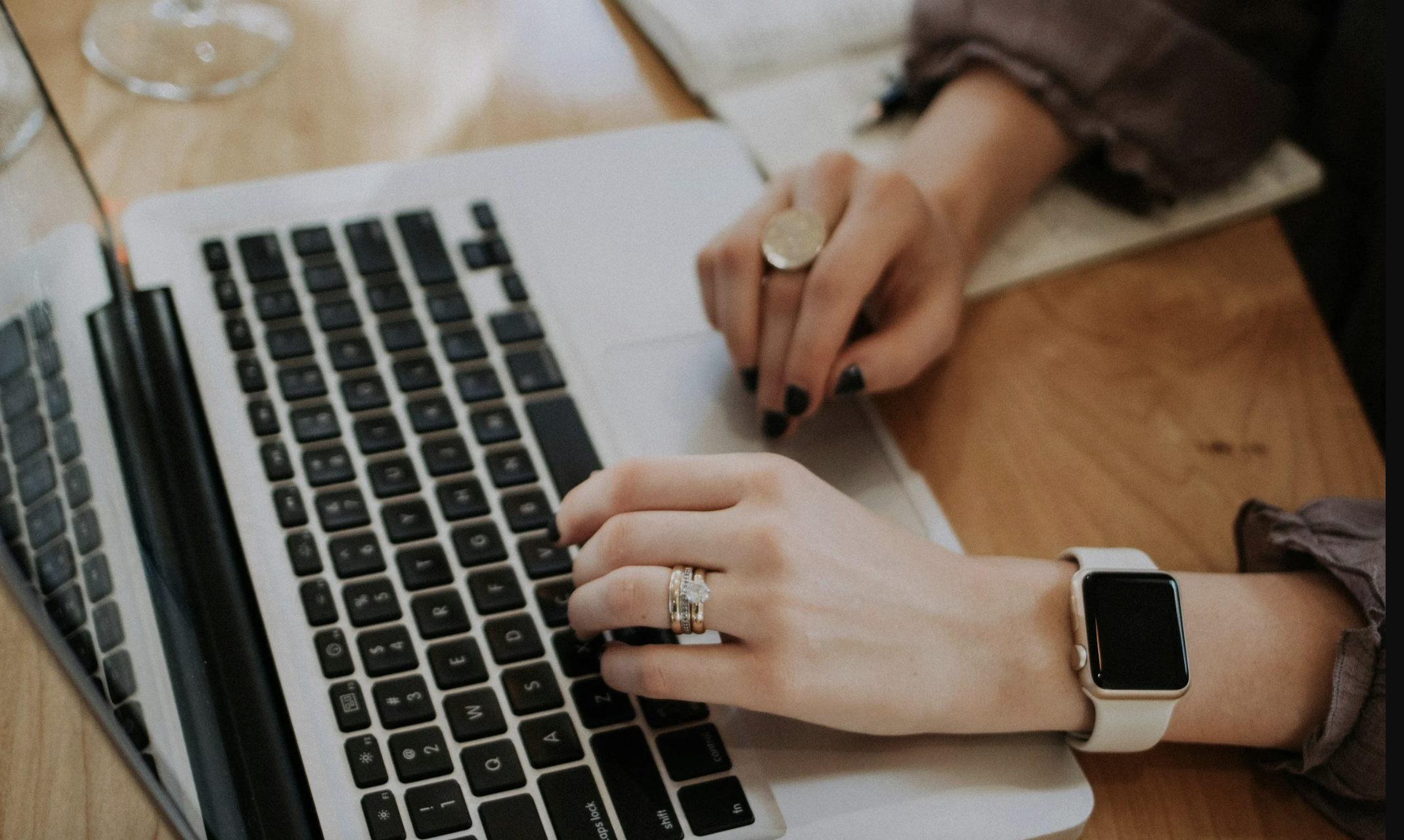 Hands working on a computer