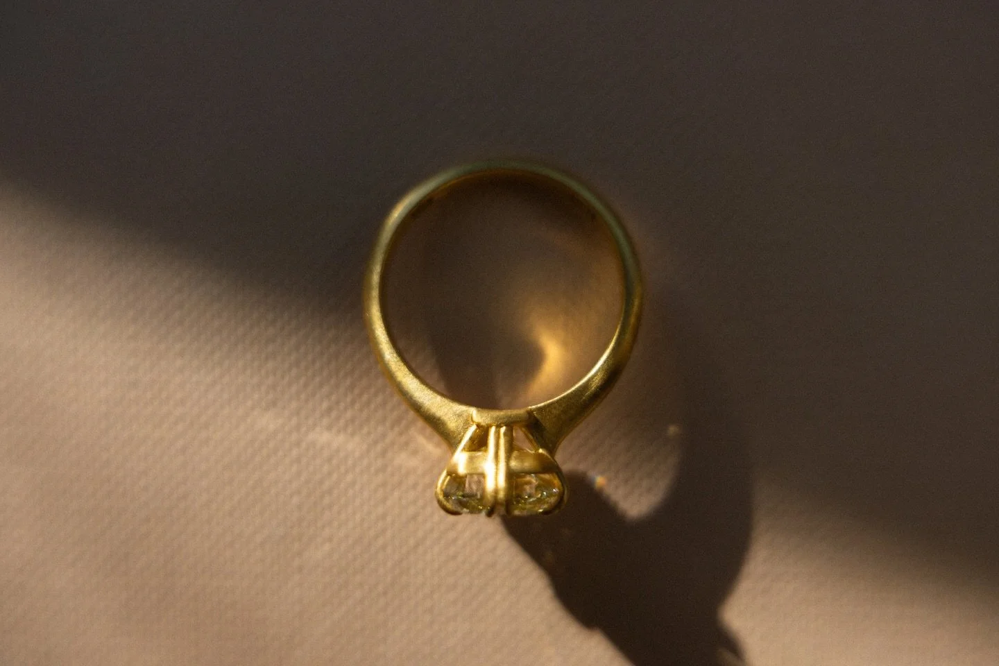 A soft yellow glow &mdash; 3.31 carats held in sculpted 18k gold.