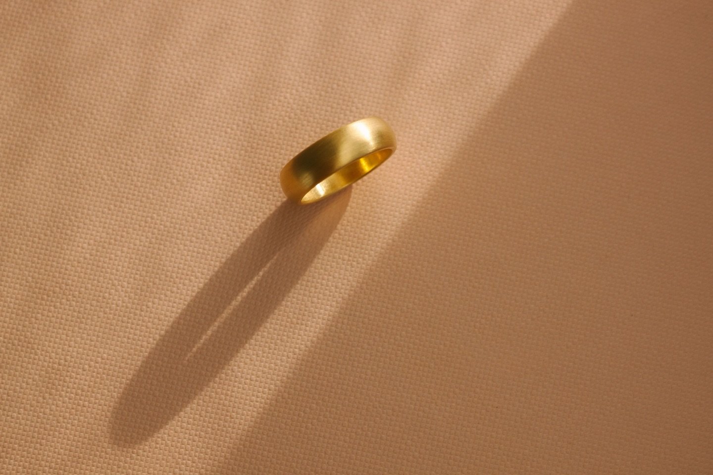 Warm, buttery 22k with a weight you feel.