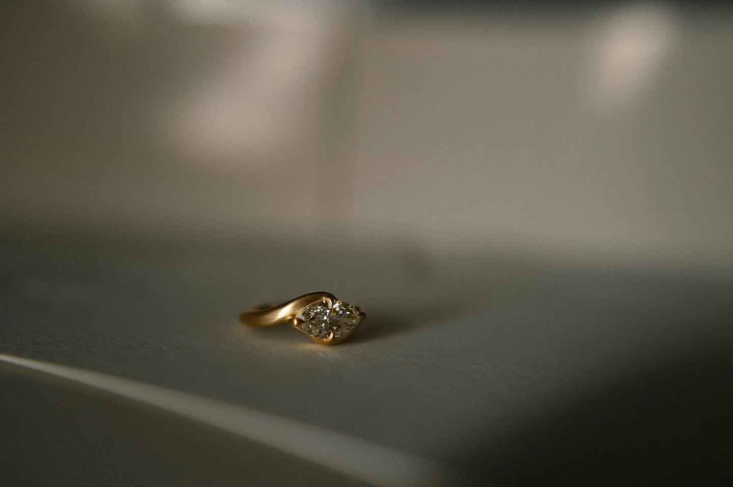 One of a kind.
A 1.50 ct faint brown marquise, softly set in 18k gold.