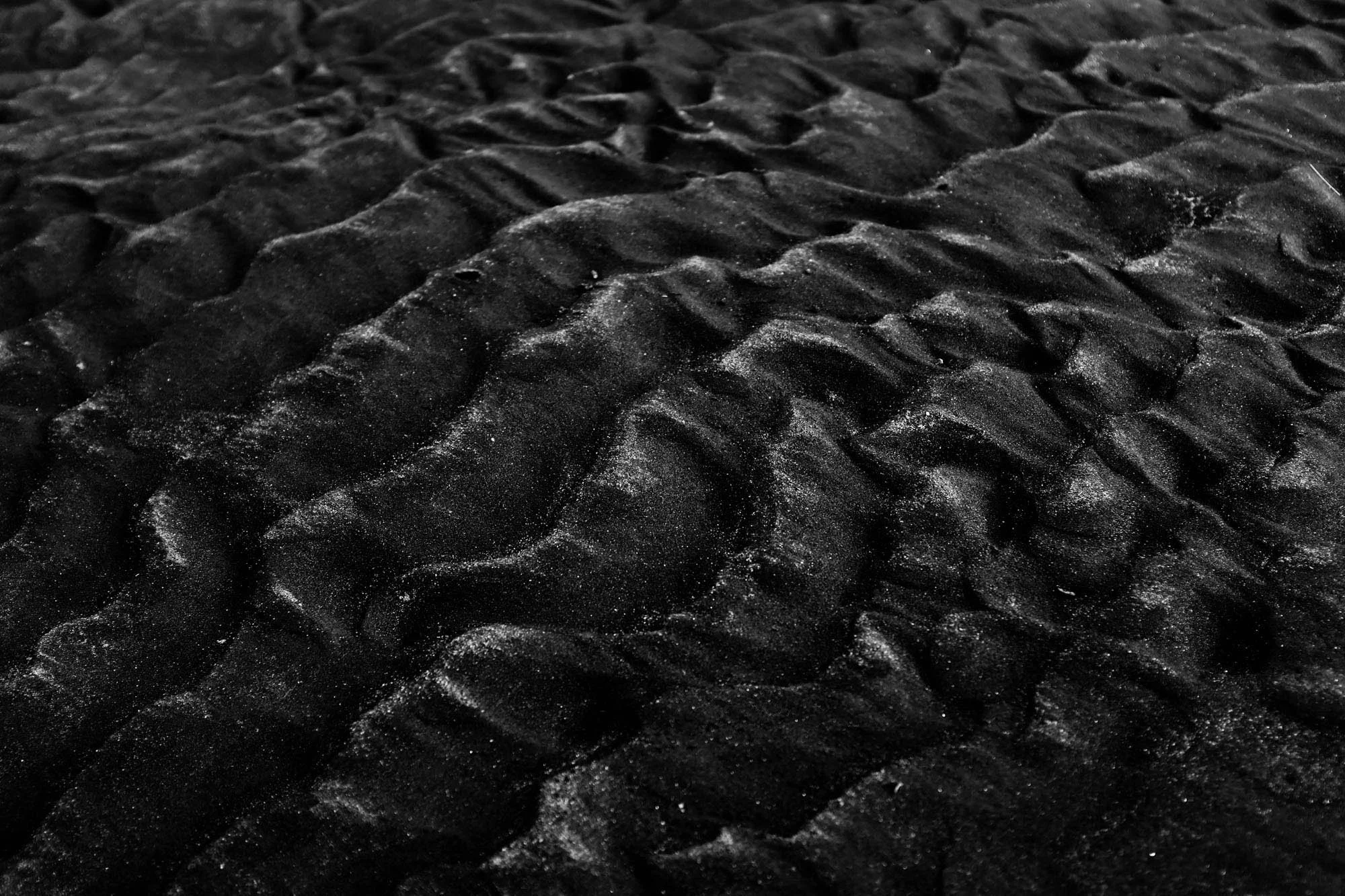 Black and white sand texture illustrating leadership development background