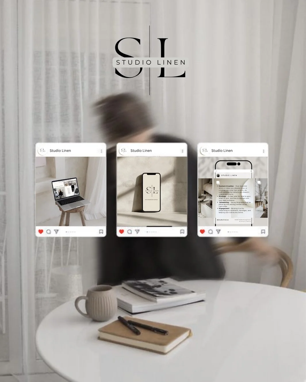 The image shows a mirror with the logo 'STUDIO LINEN' and three digital screens displaying social media posts related to Studio Linen. Behind the mirror, a person is blurred as they move, with a white curtain in the background. On a table below the mirror, there is a beige mug, a stack of magazines, a notebook, and two pens.