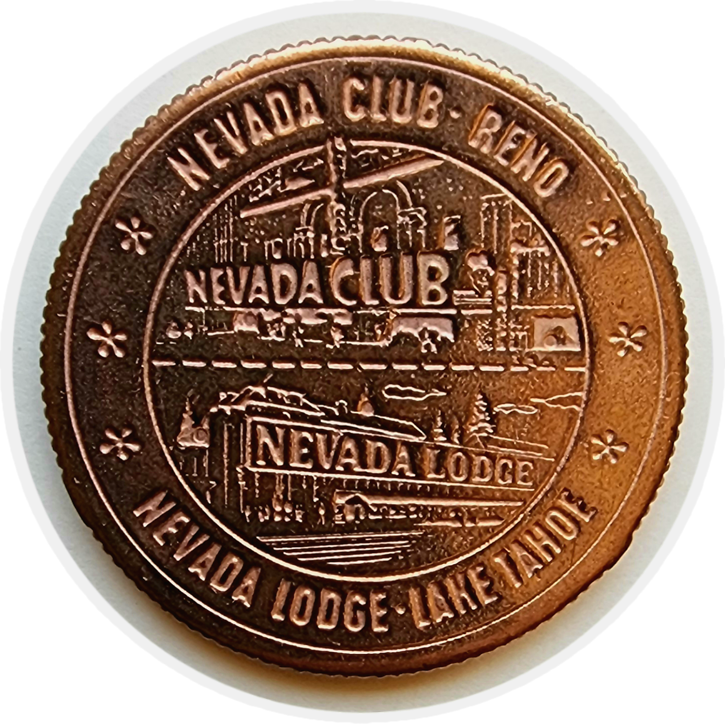 Copper-colored casino chip with the text "Nevada Club, Reno, Nevada Lodge, Lake Tahoe" and a scenic illustration of buildings, trees, and water.