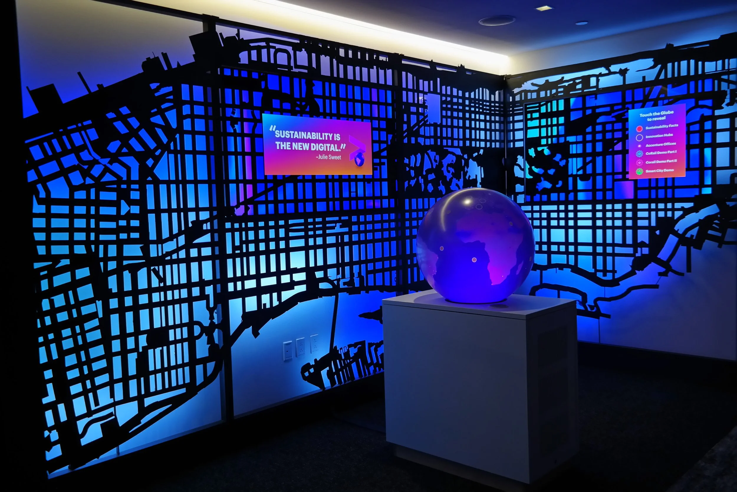 The globe in the center is a touch-reactive display, becoming the control panel to explore the information.