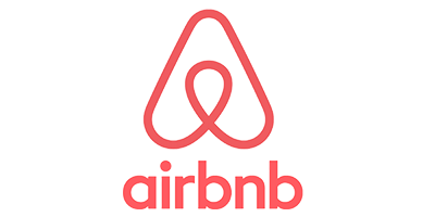 Airbnb logo with a stylized letter 'A' shape above the word 'airbnb' in pink.