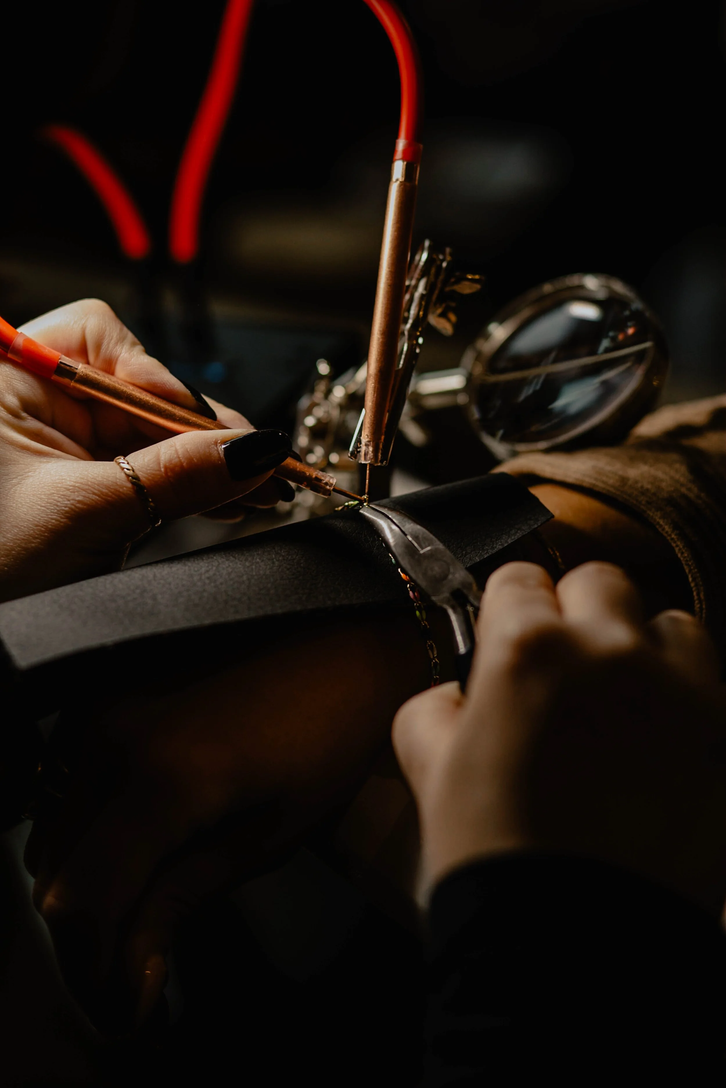 A person welding a metal piece with a welding torch, with sparks and equipment visible in the background. Seattle professional head shot photography