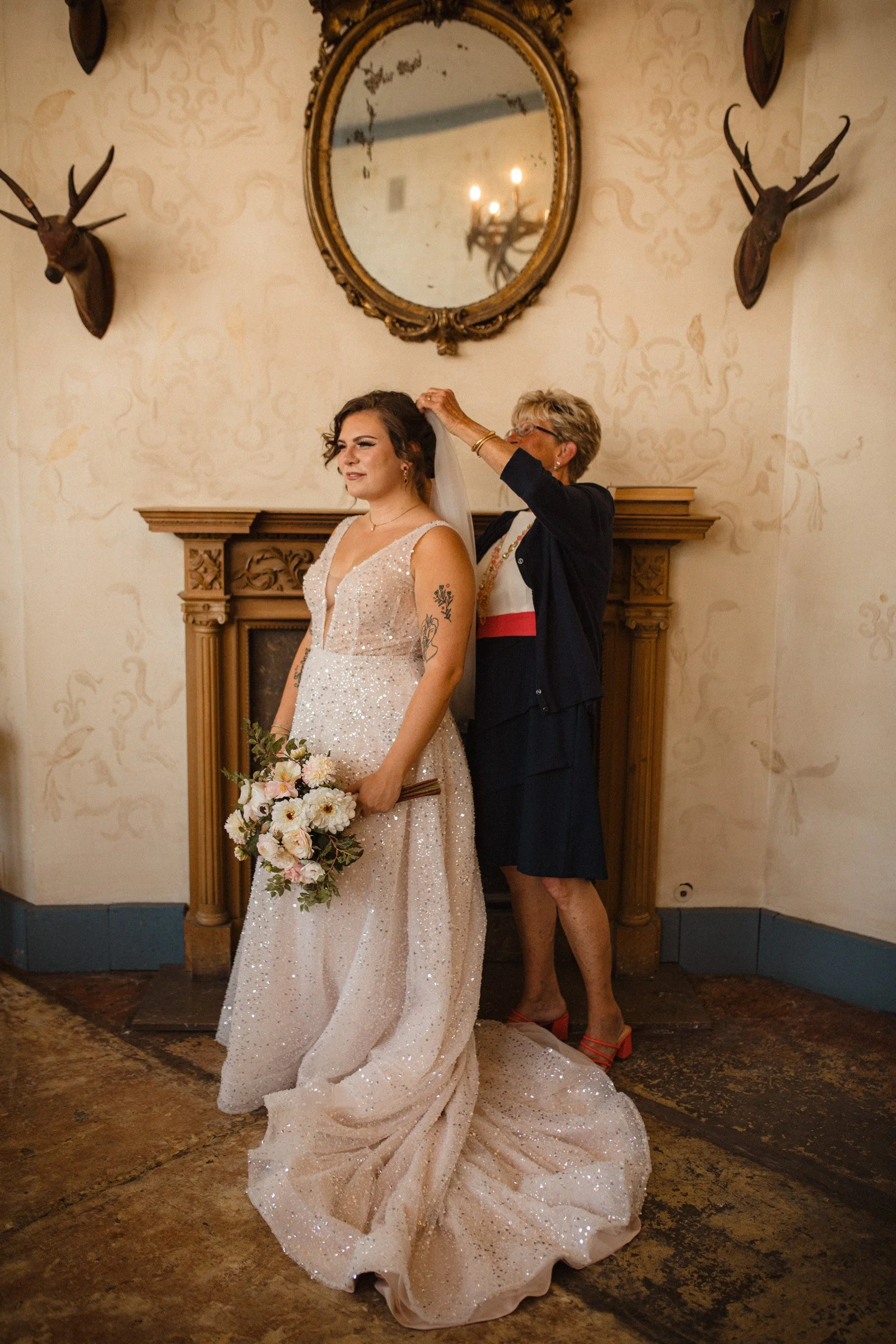 Grandma of the bride helps her place her veil in the bridal suite of The Ruins, Queen Anne, Seattle