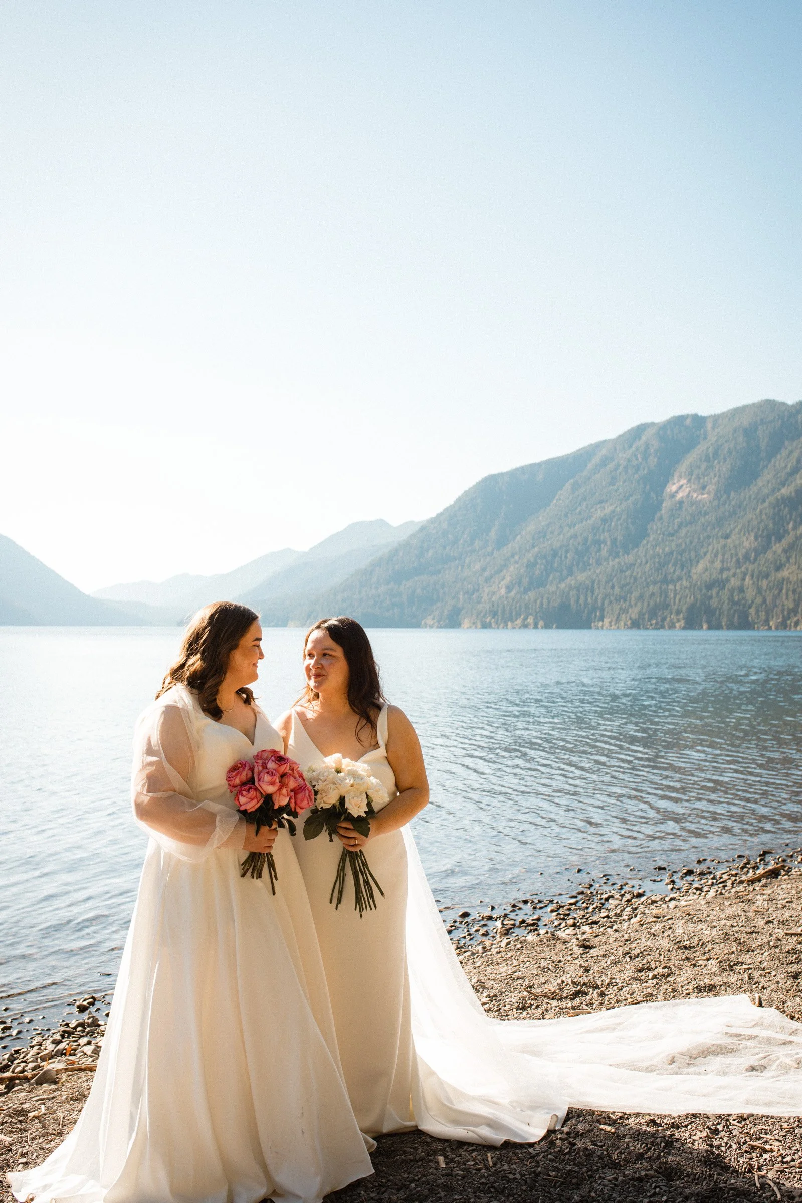 Two brides posing together during wedding portraits in Port Angeles, Washington