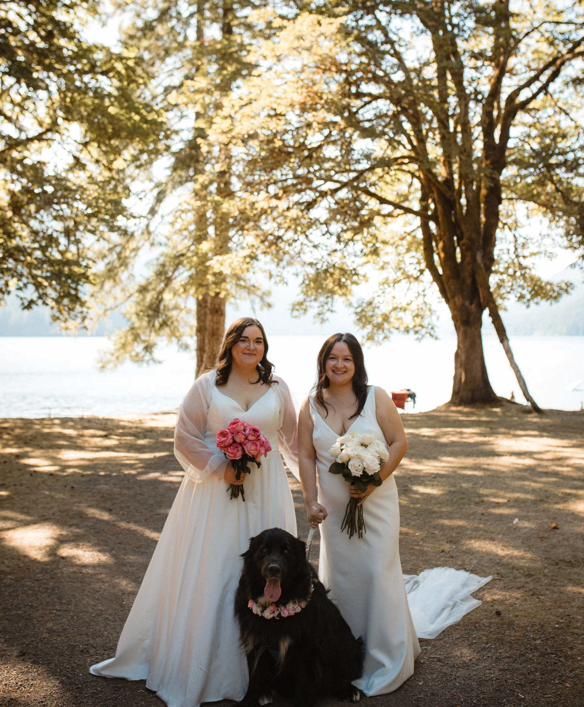 Two brides posing together during wedding portraits in Port Angeles, Washington