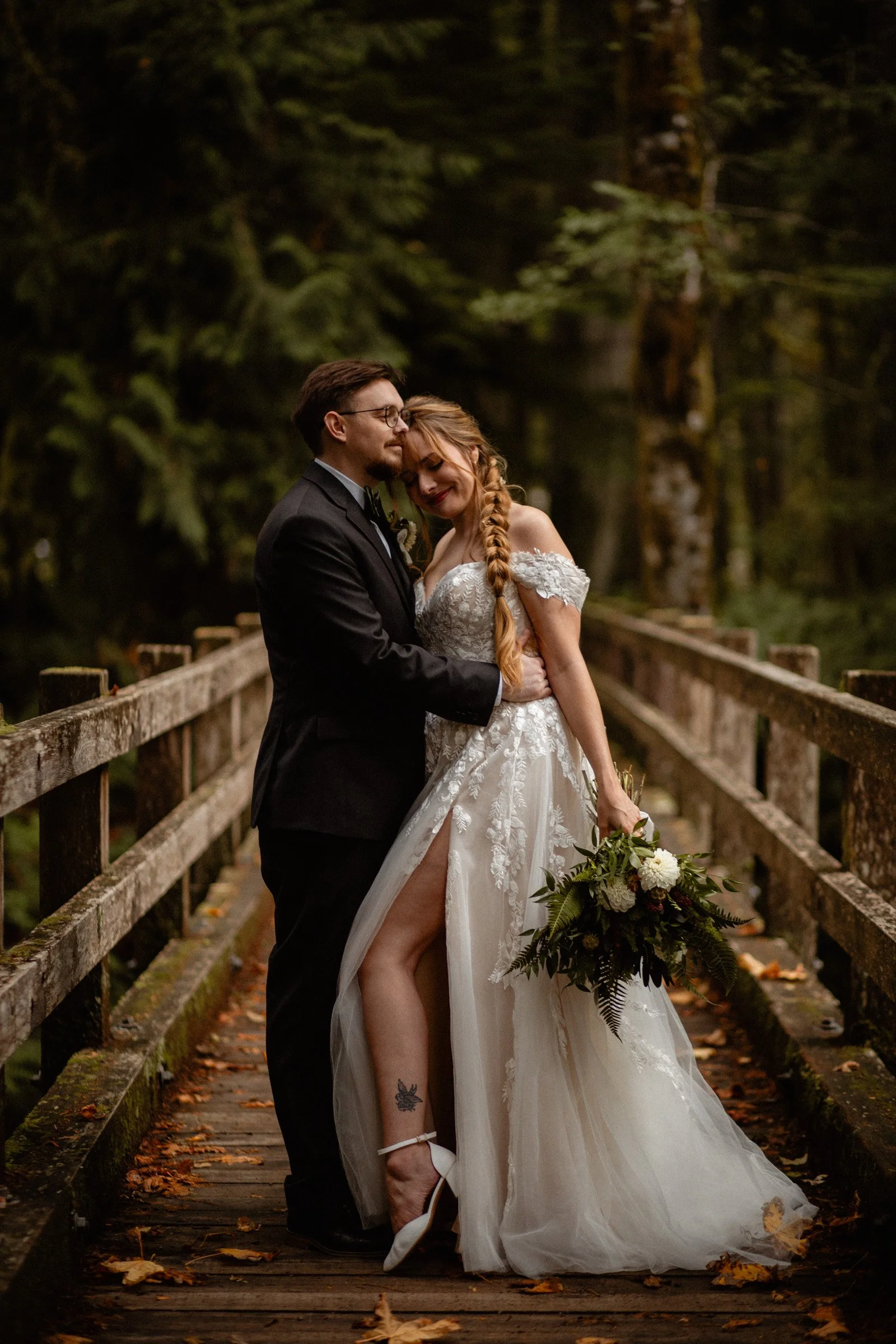 Bride and groom posing together in a forest setting during their Lake Crescent Lodge wedding in Port Angeles, WA.