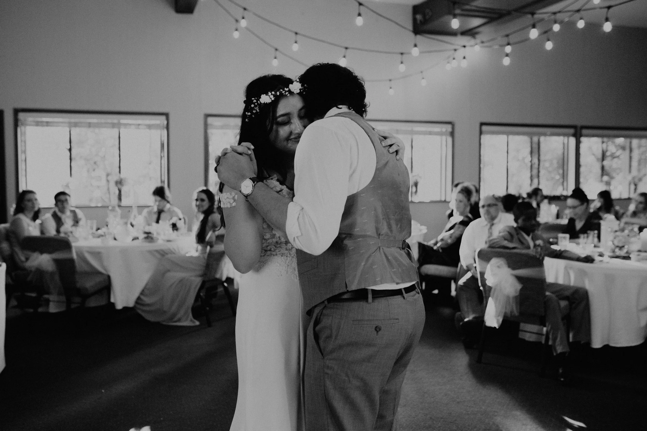A bride and groom share a dance at their wedding reception. Seattle, WA wedding photography.