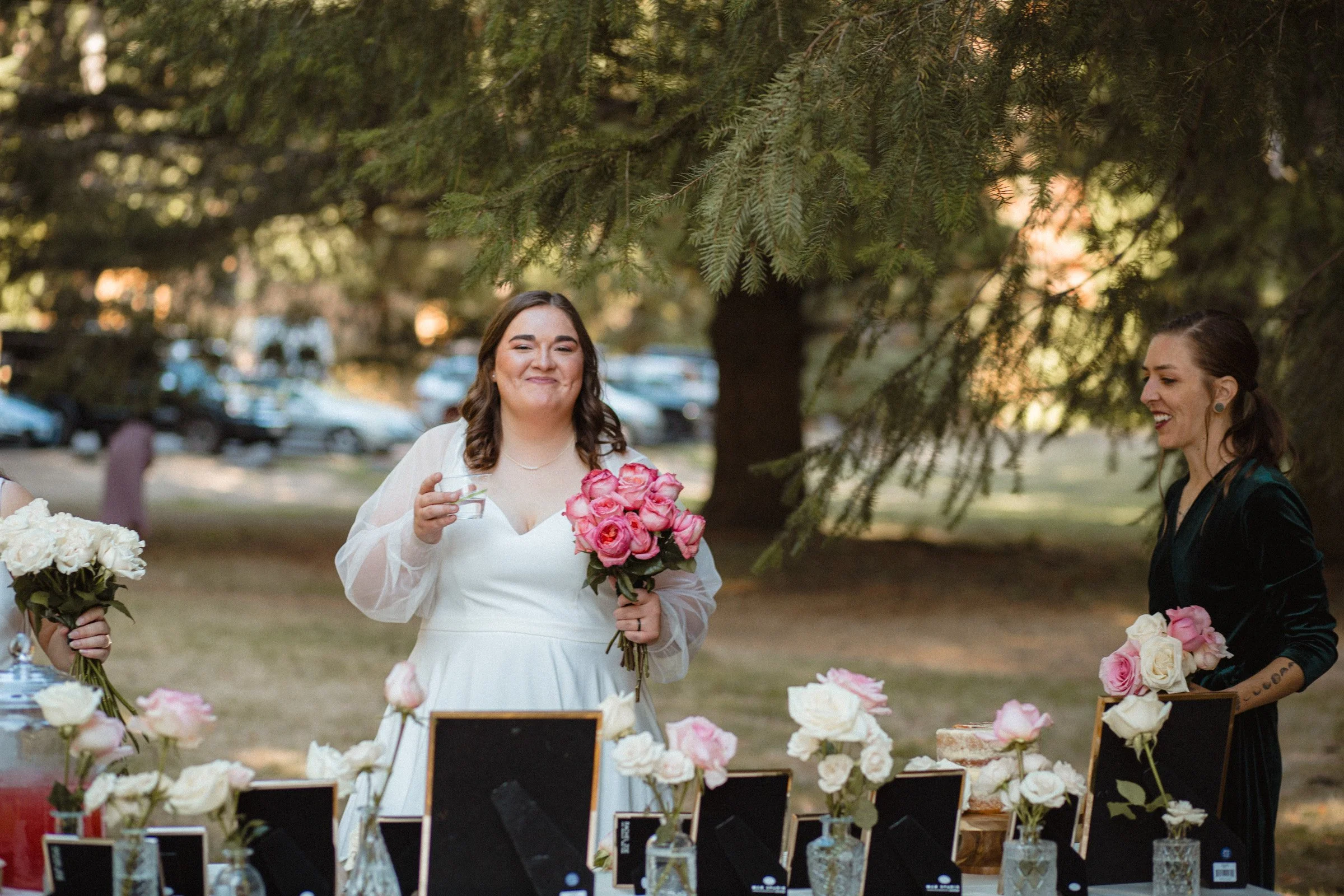 “Two brides slicing their wedding cake at Lake Crescent in Port Angeles, Washington”