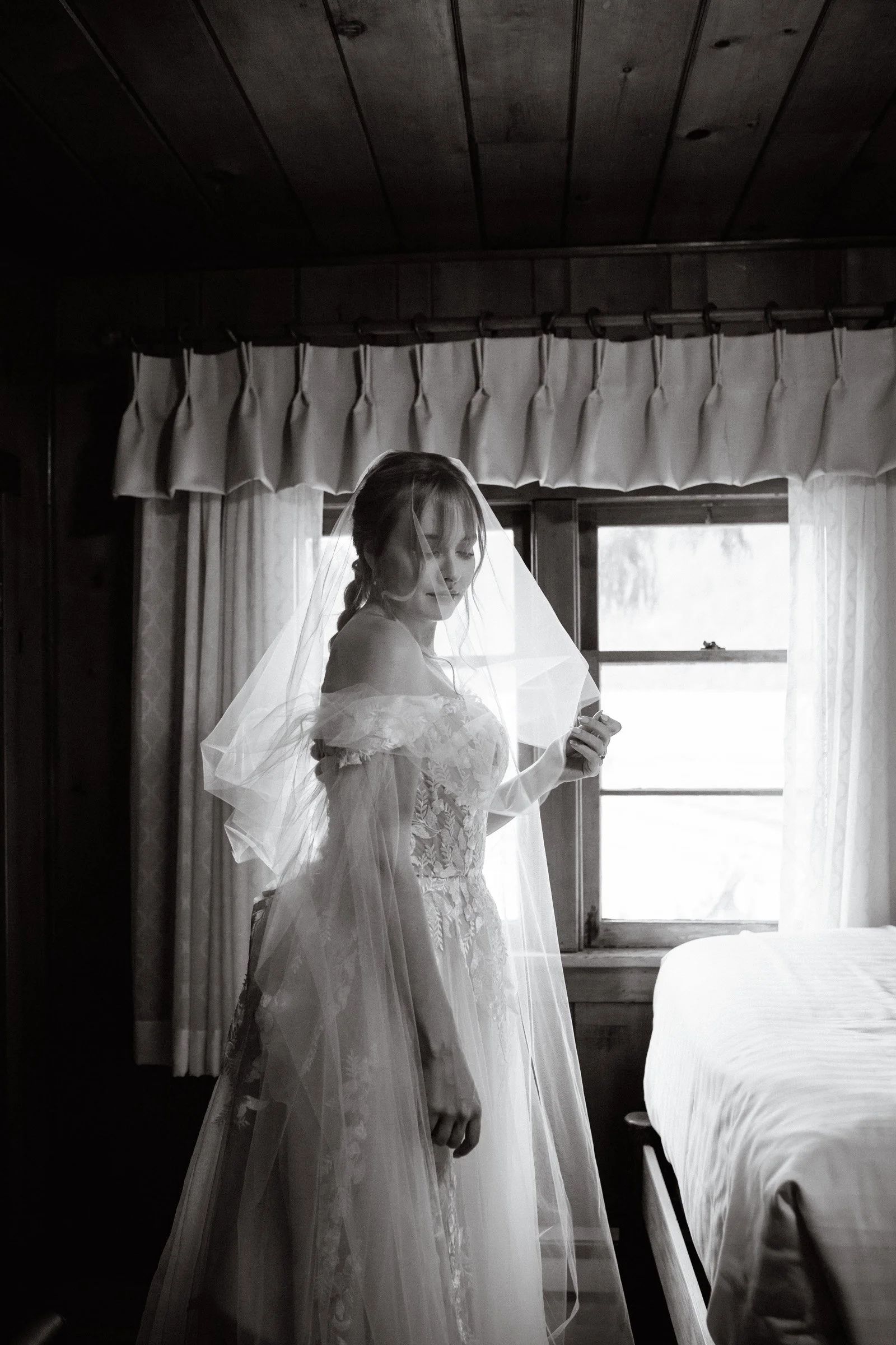 Bride putting on her wedding shoes in the bridal suite at Lake Crescent Lodge in Port Angeles, WA.