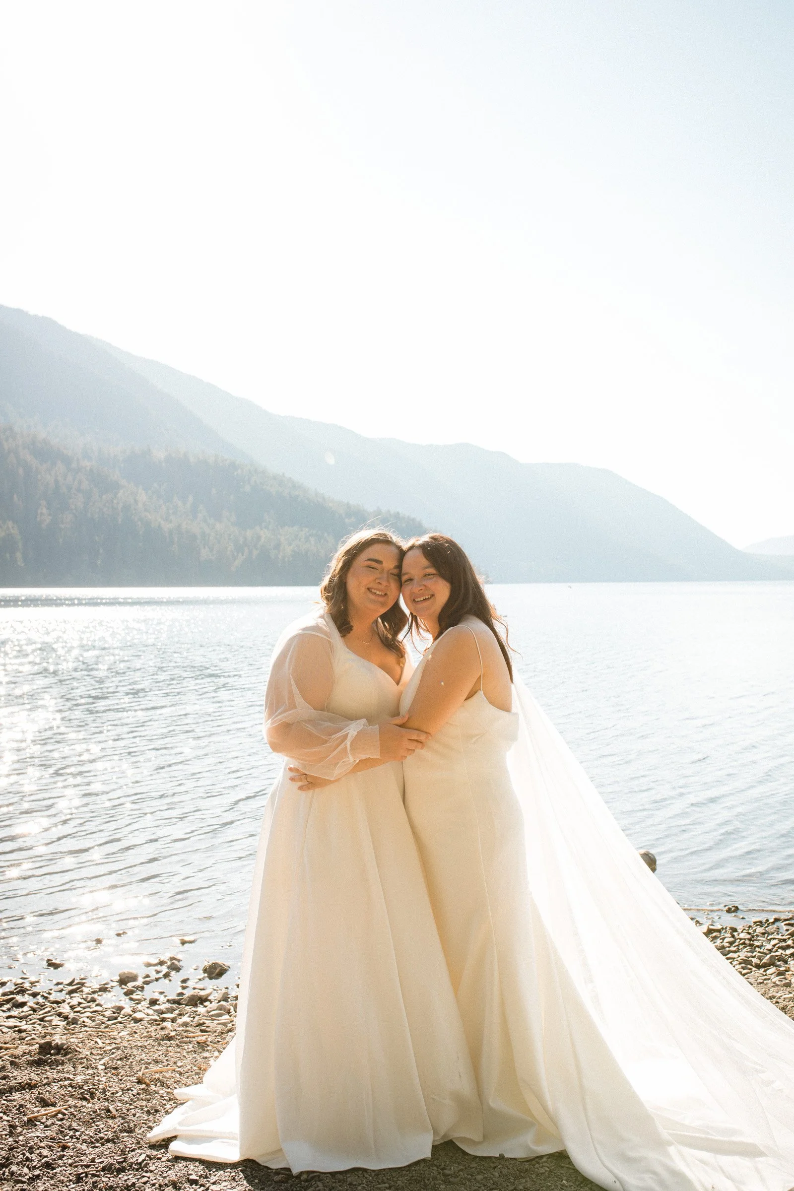 Two brides posing together during wedding portraits in Port Angeles, Washington