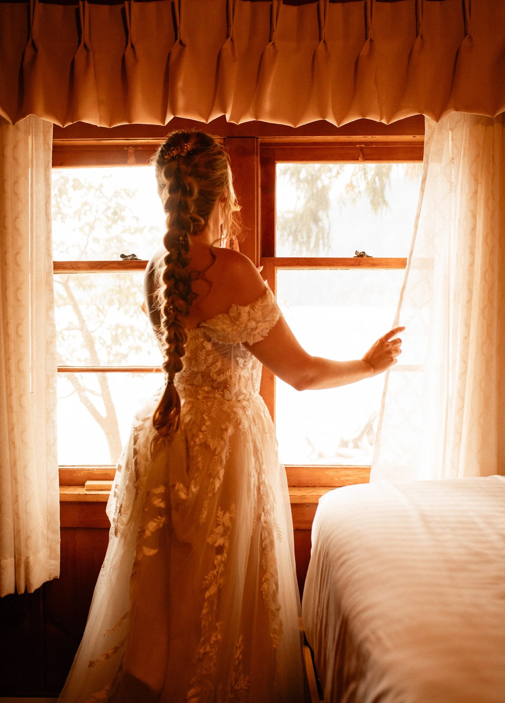 Bride slipping on her shoes in a quiet getting-ready moment before her Lake Crescent wedding at Lake Crescent Lodge.