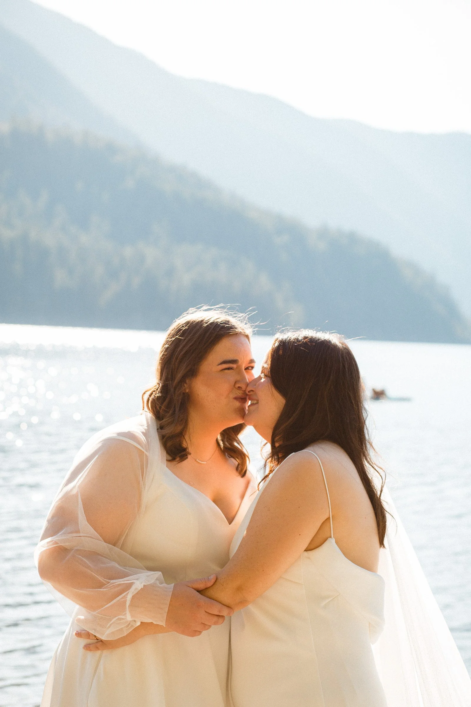 Two brides posing together during wedding portraits in Port Angeles, Washington
