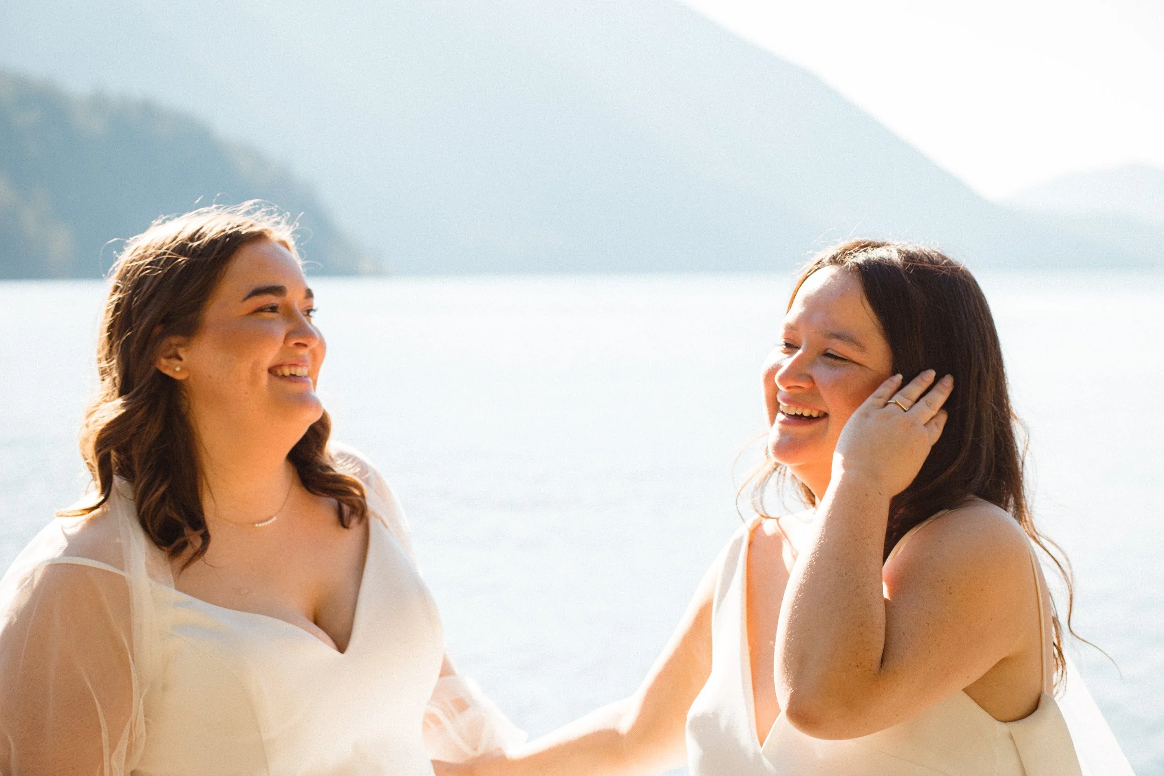 Two brides posing together during wedding portraits in Port Angeles, Washington