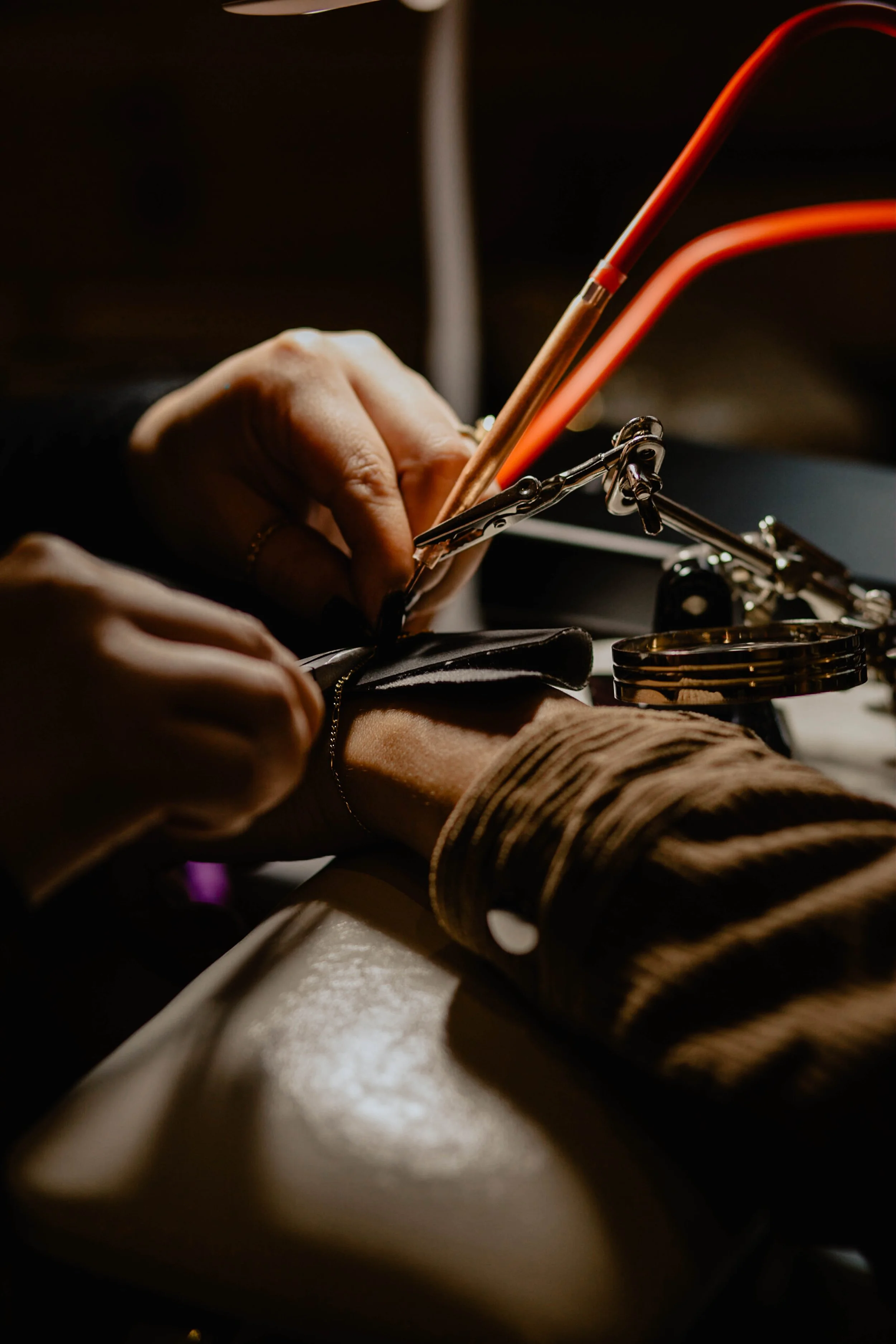 Person getting a tattoo with a tattoo needle and ink on their arm. Seattle professional head shot photography