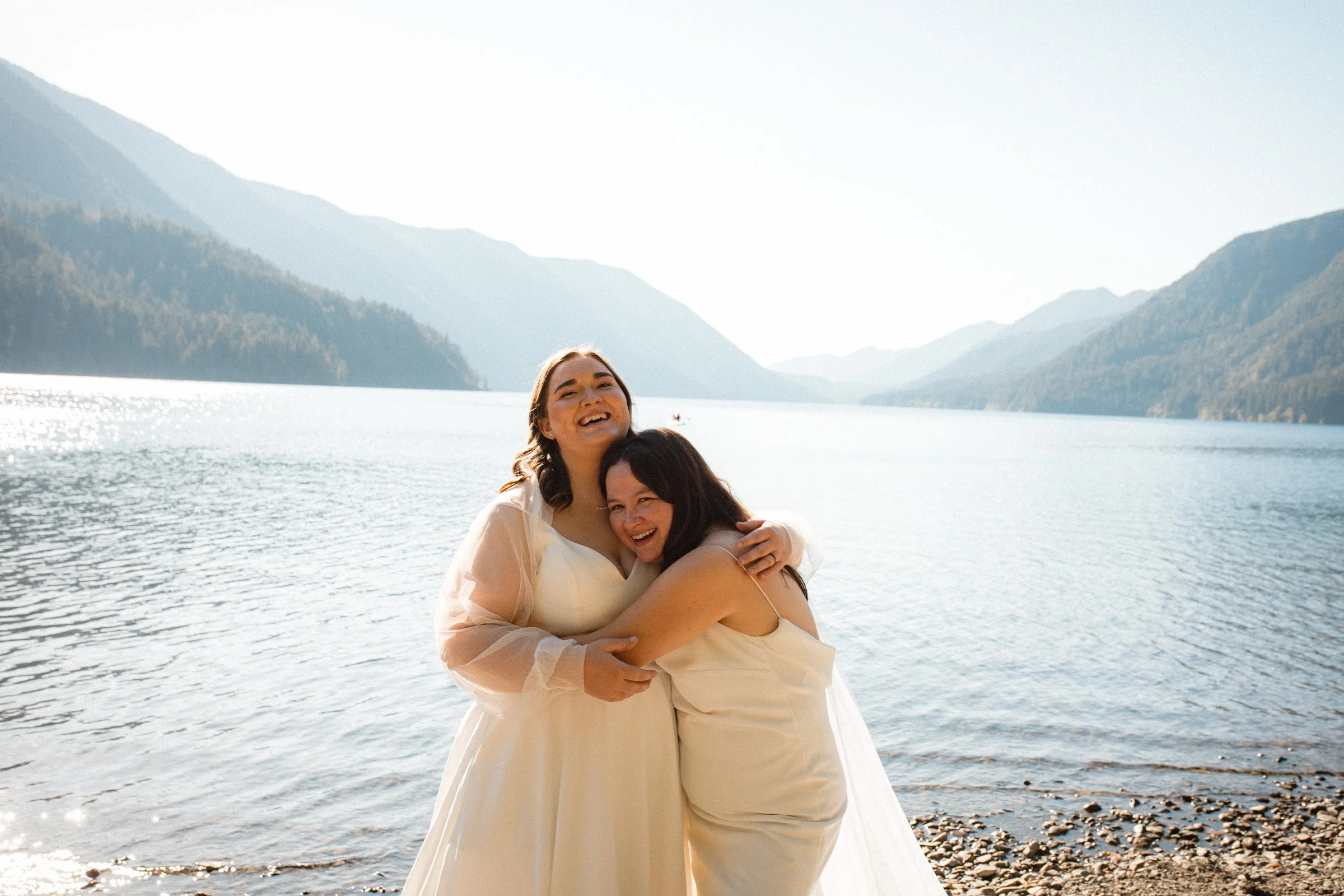 Two brides posing together during wedding portraits in Port Angeles, Washington
