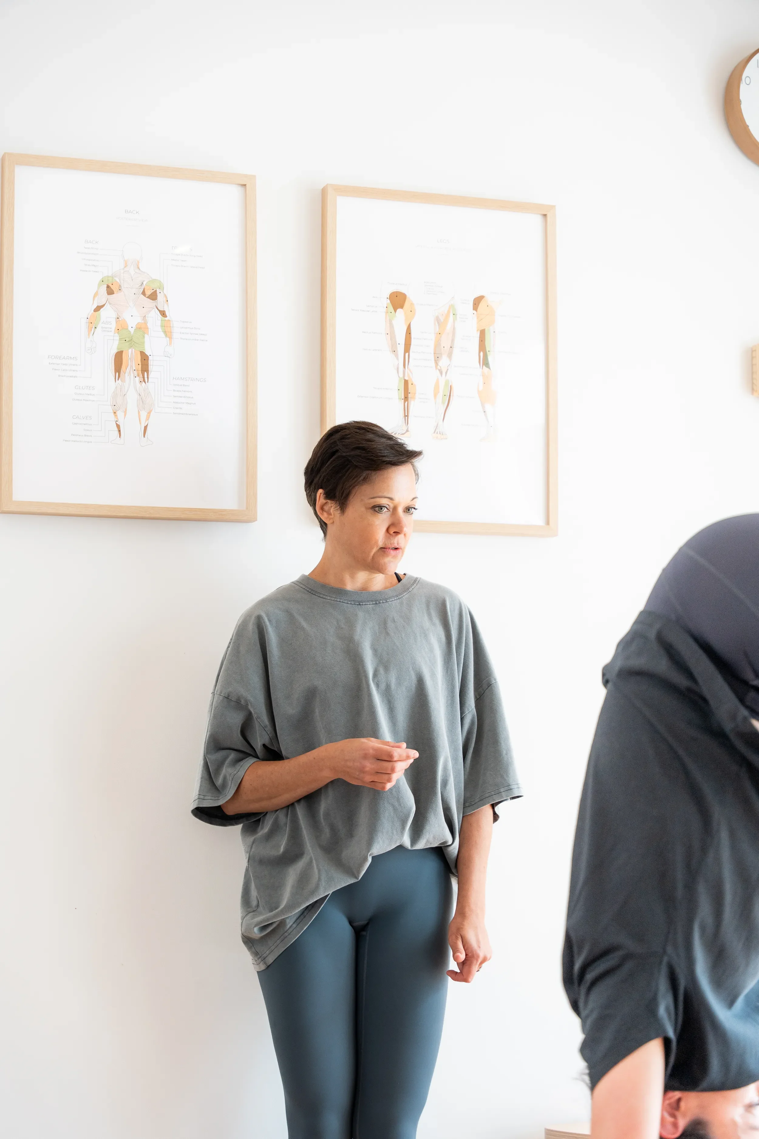 Tegan Duncan guiding a client through a personalised one-to-one Clinical Pilates session in her light-filled Seddon studio.