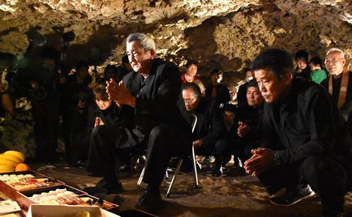 Okinawans praying to those who lost their lives in the war
