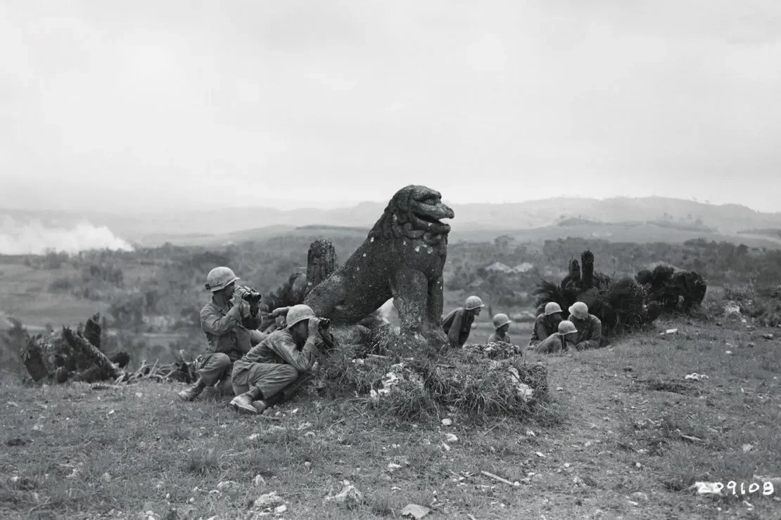 American soldiers in the battle of Okinawa behind a shisa