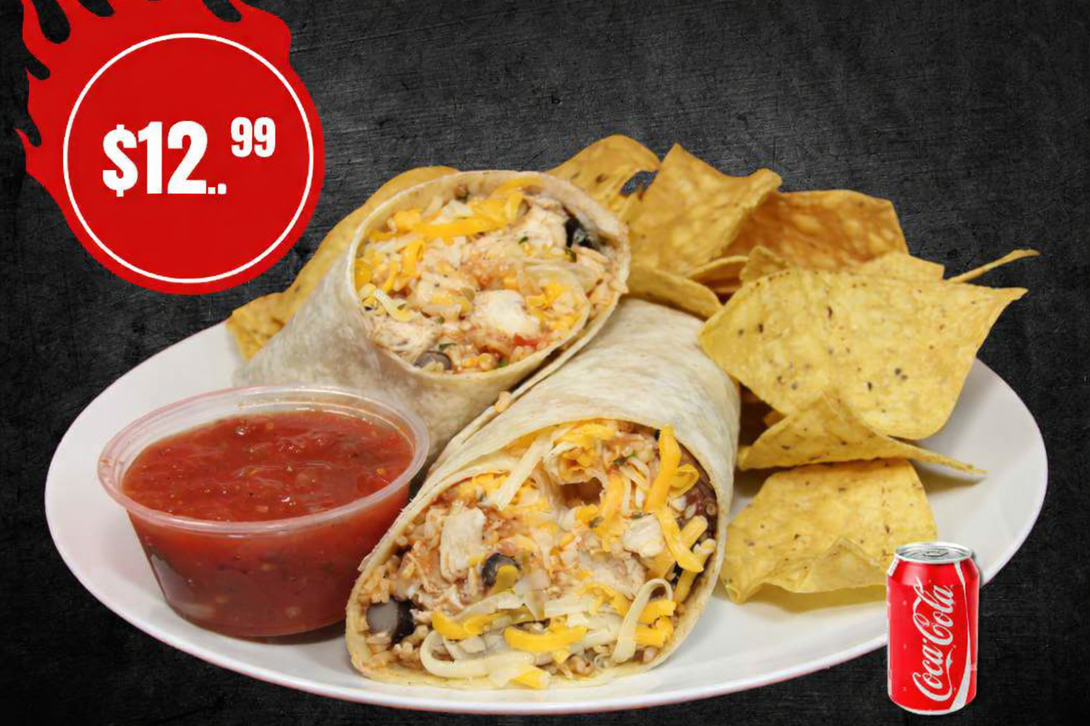 A grande burrito with fries, a pickle, and a drink