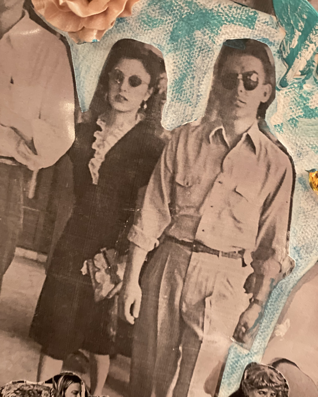 Black and white collage photo of a man and a woman holding hands, both wearing sunglasses. The woman has long hair and is dressed in a dark coat with a ruffled shirt underneath. The man wears a light-colored, button-up shirt with rolled-up sleeves and high-waisted pants.