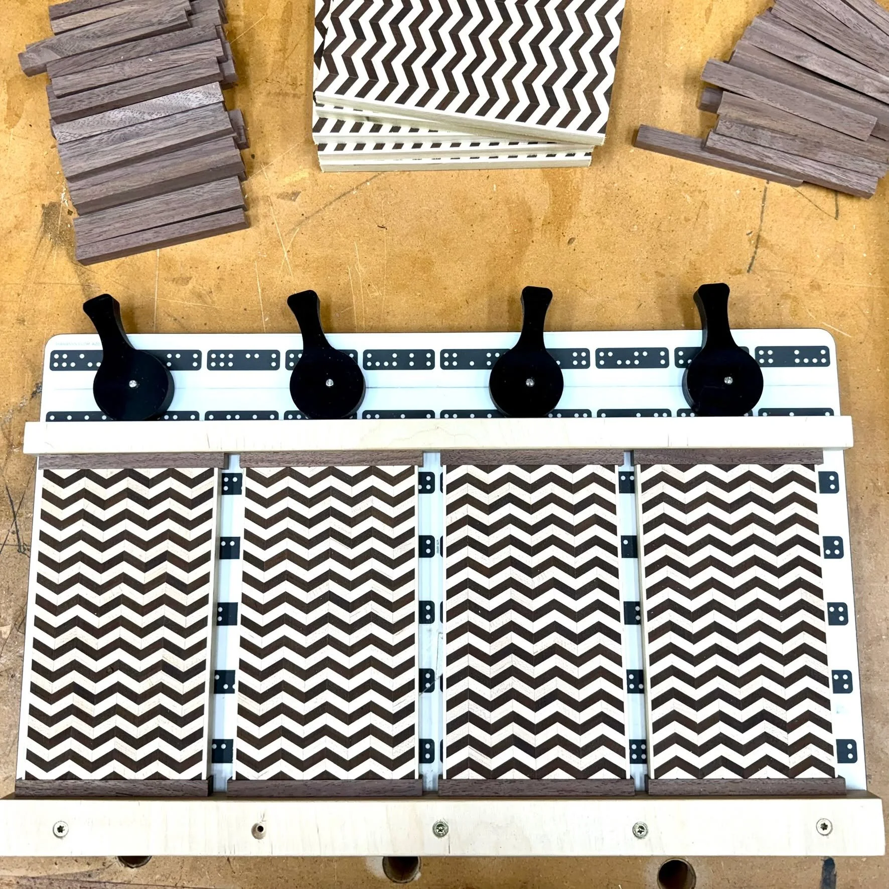 I repurposed a damaged Shaper Workstation surface into a clamping jig for gluing the walnut trim on the Detour box side panels. The surface was scarred by a loose router bit, but I kept it knowing it would eventually earn a second life.

Clamping sma