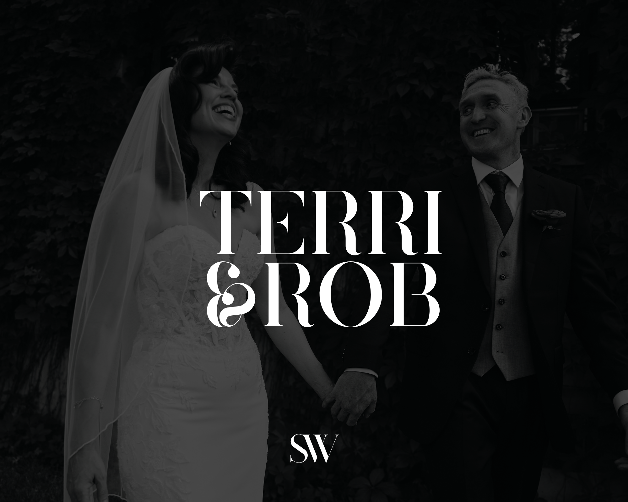 A black and white photo of a bride and groom holding hands, smiling and looking at each other, outdoors in front of foliage. Overlaid text reads "Terri & Rob" and "SW."