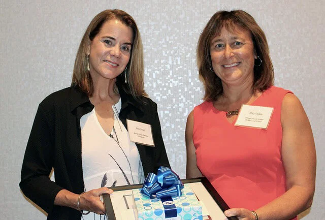 Jennings Foundation President &amp; Chair Anne Juster (left) presents the 2021 Arthur S. Holden Teacher Award for Excellence in Science Education to Amy Didion (right), an 8th-grade science teacher at Briar Middle School in the Perkins Local School District.