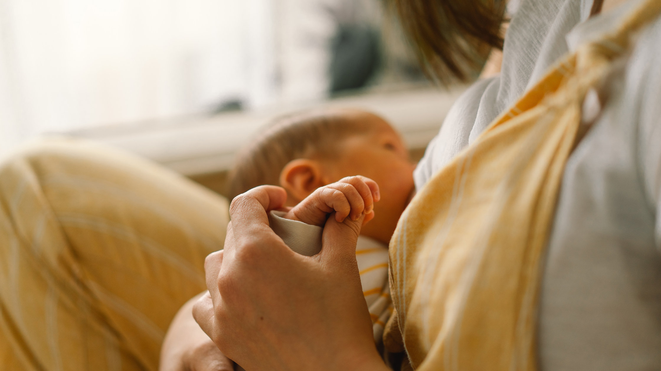 mom breastfeeding baby